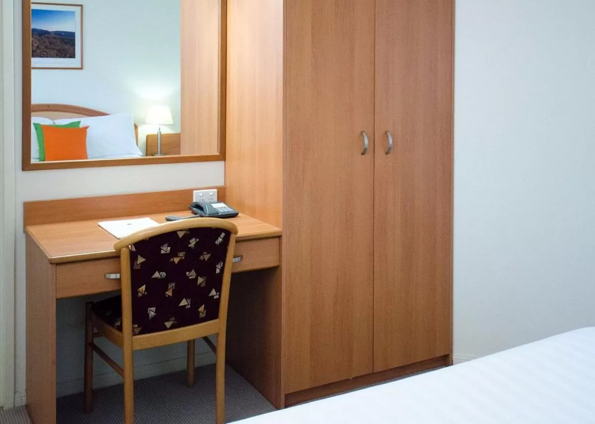 Bed in Pegasus Motor Inn and Serviced Apartments