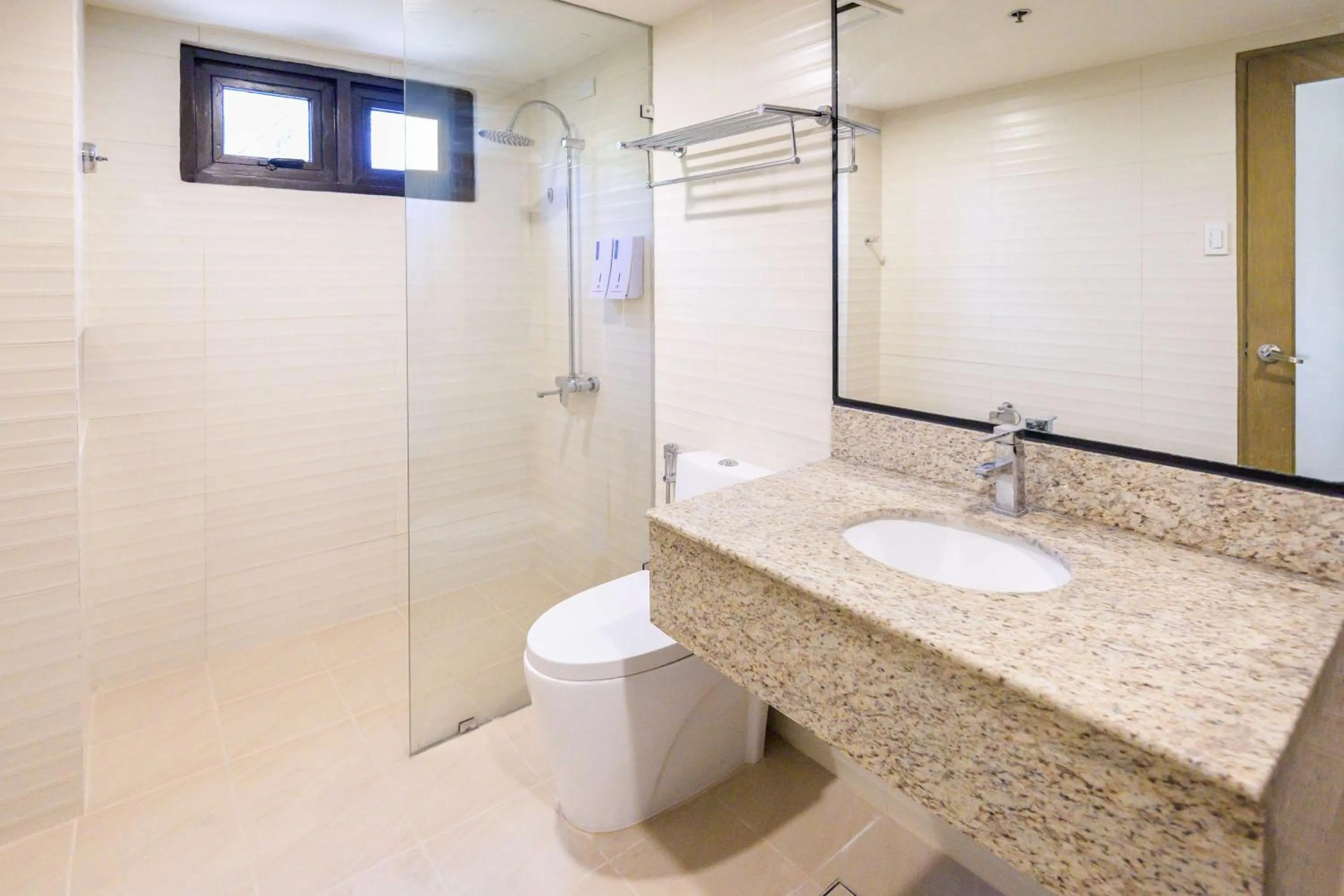 Bathroom in SureStay Plus by Best Western Cebu City