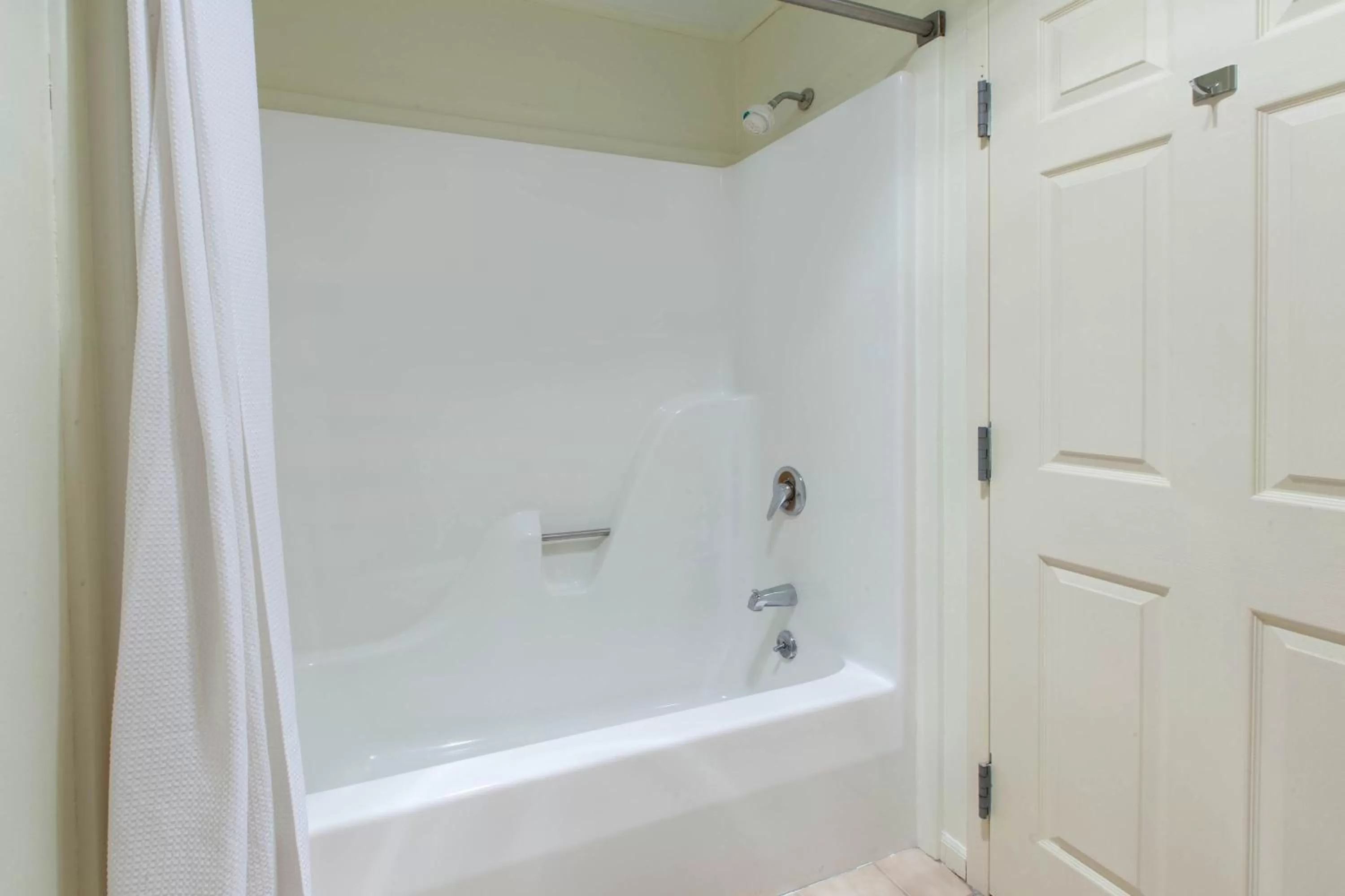 Bathroom in Apple Tree Inn; SureStay Collection by Best Western
