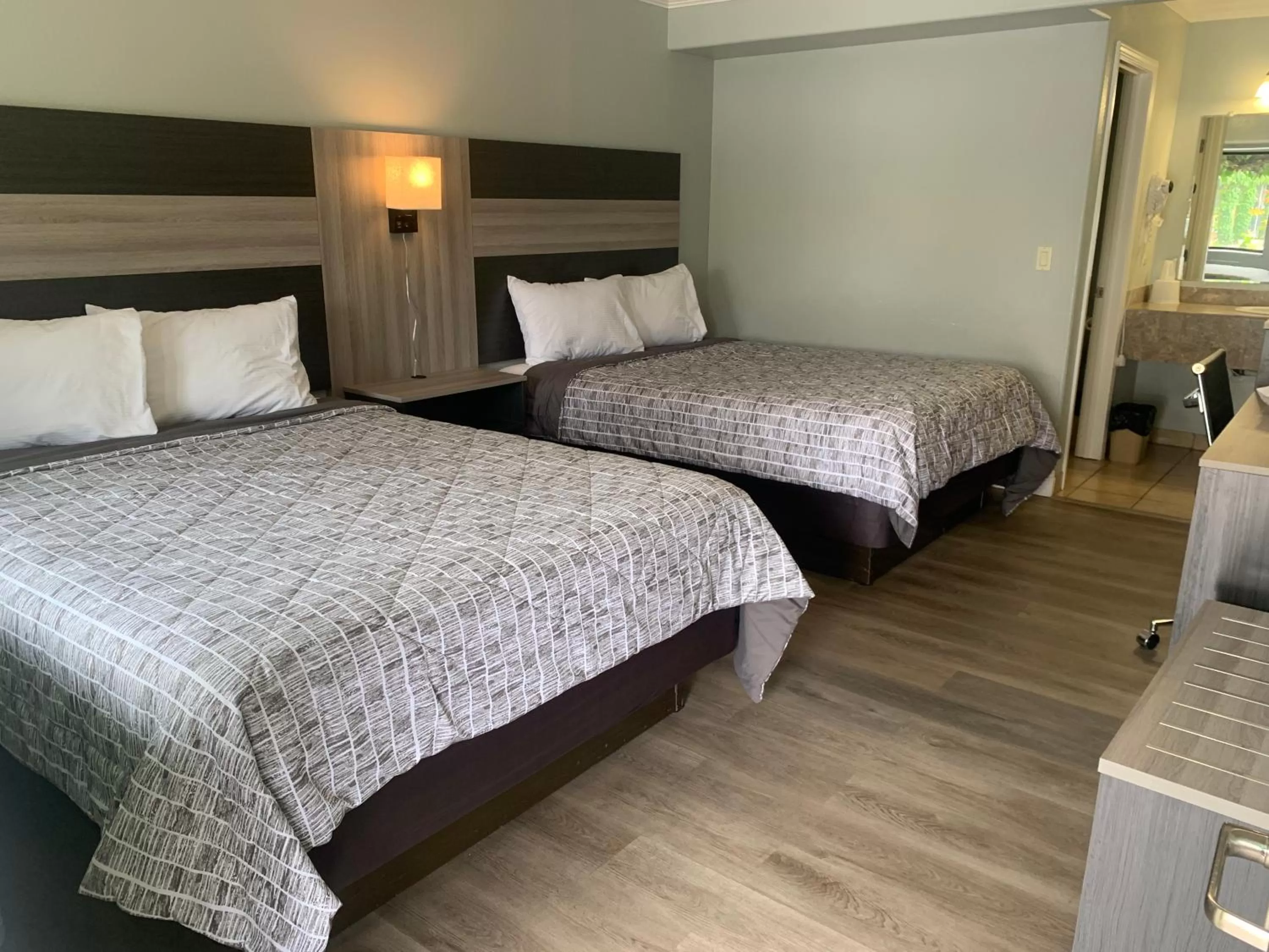 Bed in Monterey Oceanside Inn