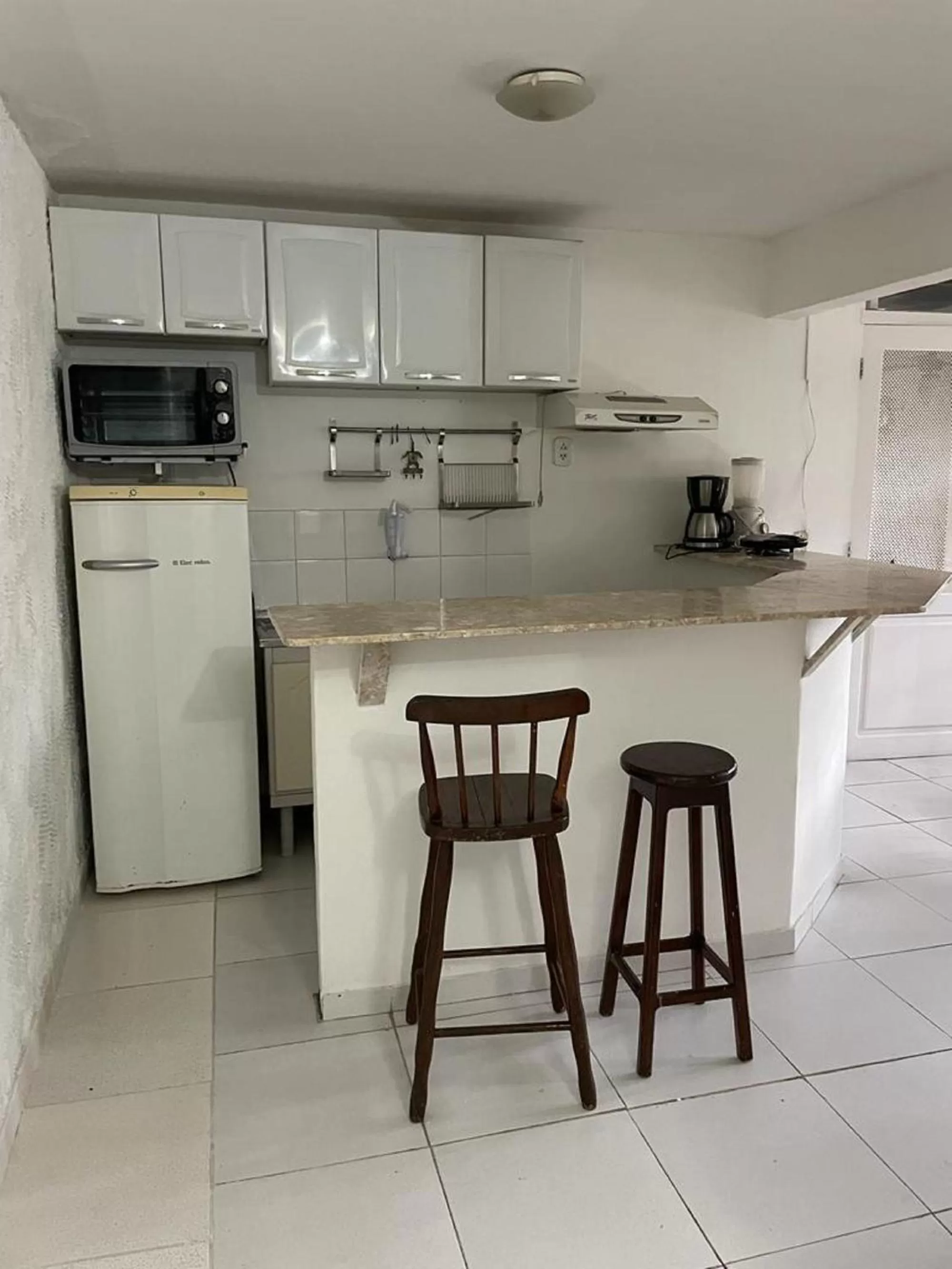 Kitchen or kitchenette in Pousada Saint Germain