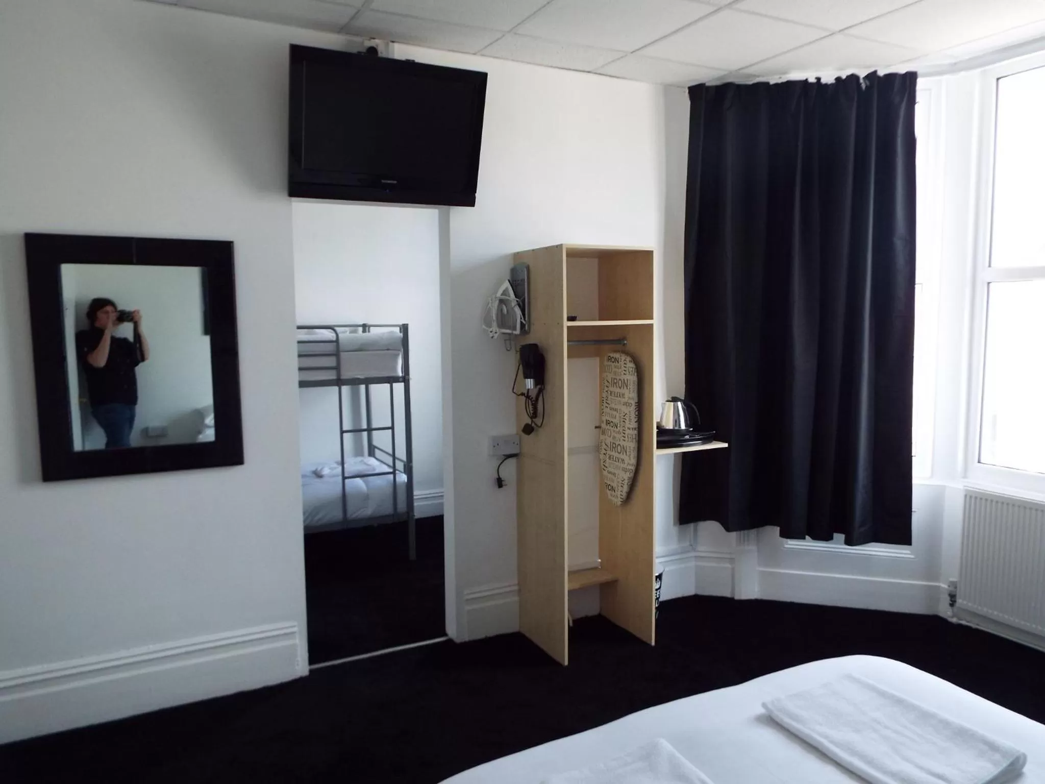 TV/Entertainment Center in Alfies Hotel