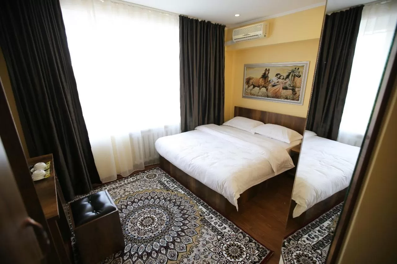 Bed in Altai Business Hotel