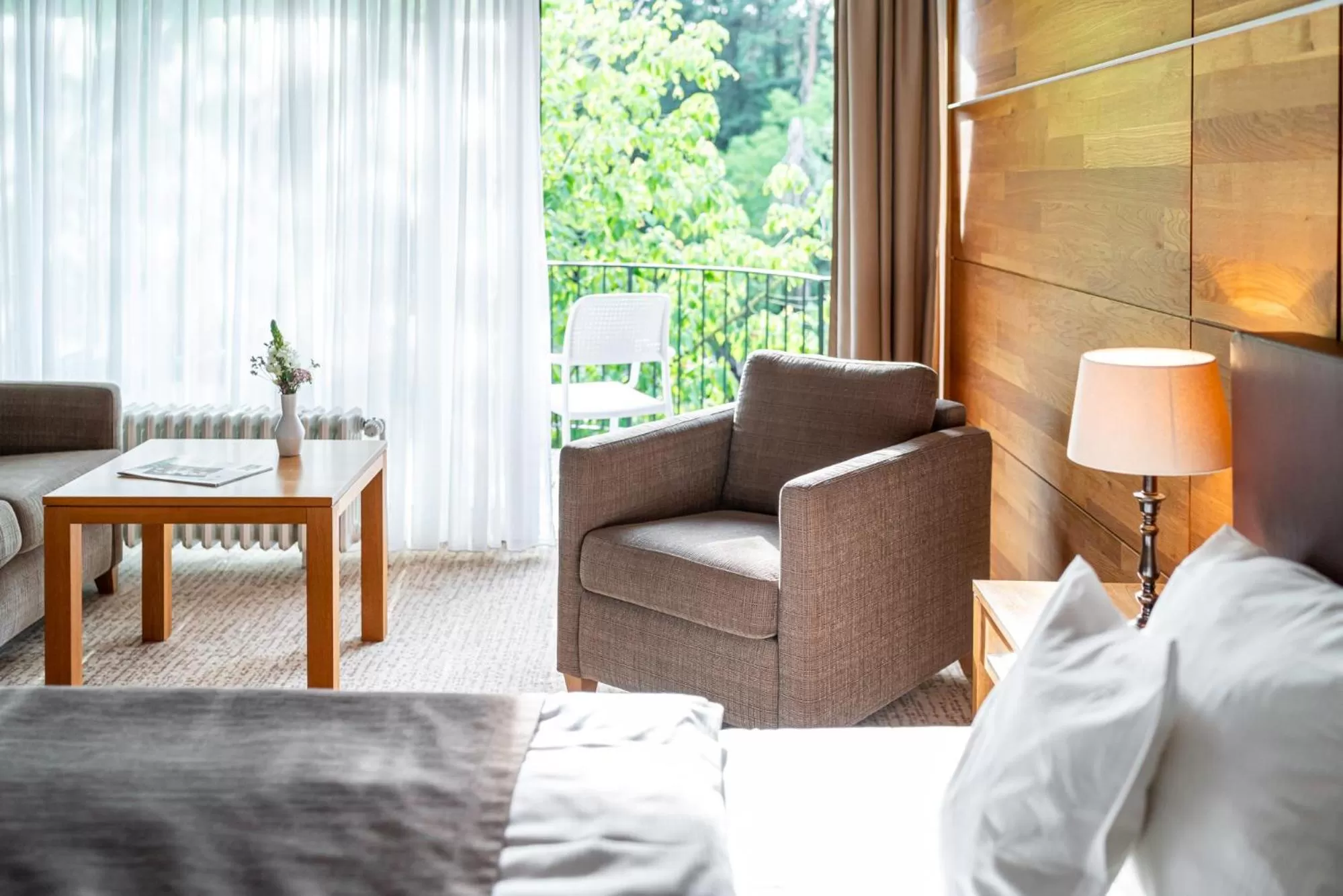 Seating area, Bed in Waldhotel Tannenhäuschen