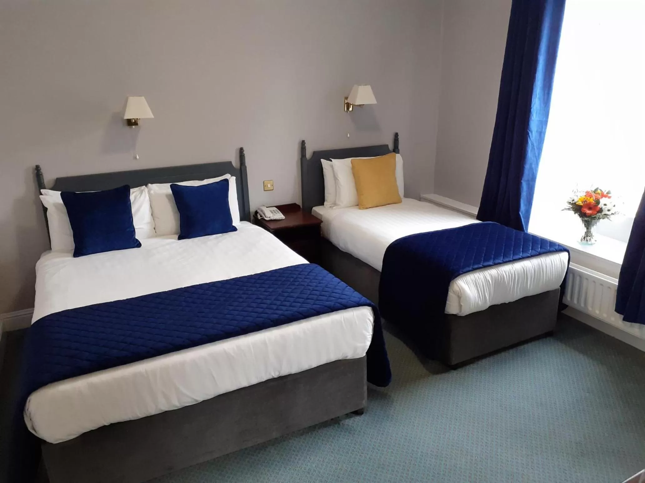 Bed in Commodore Hotel