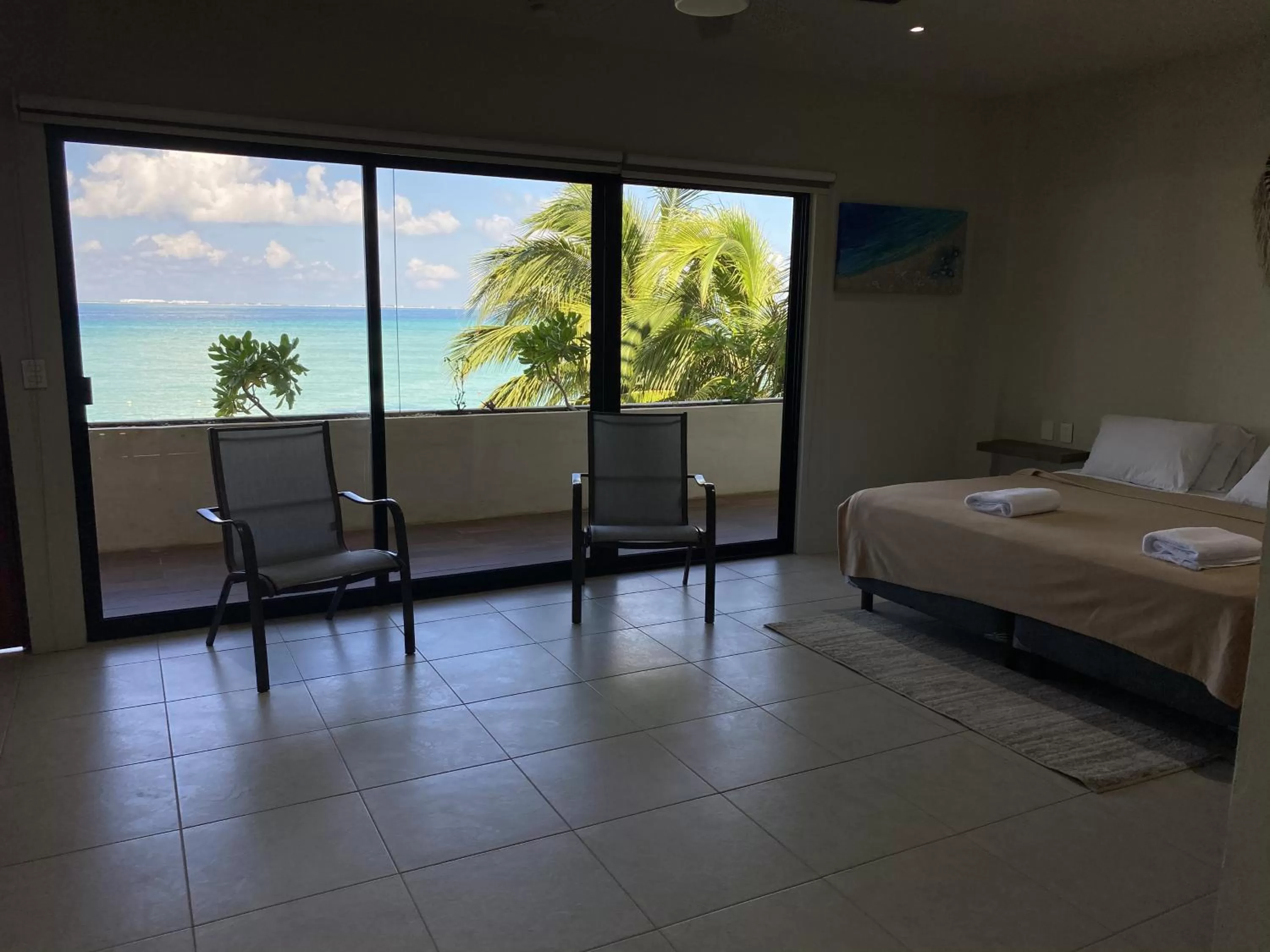 Balcony/Terrace, Bed in Cuxos Hotel Beachfront