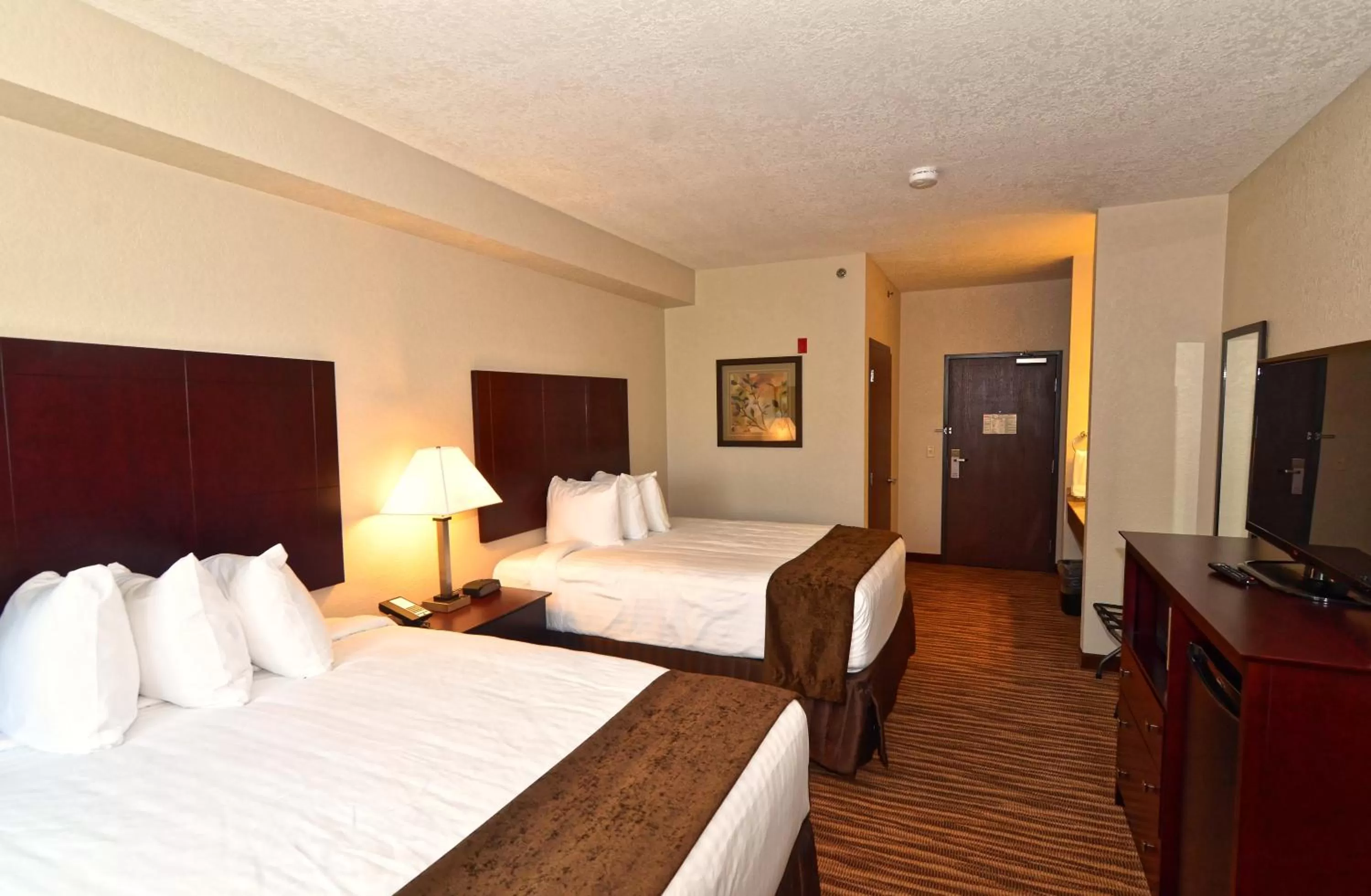 Bed in Cobblestone Inn & Suites - Clarion