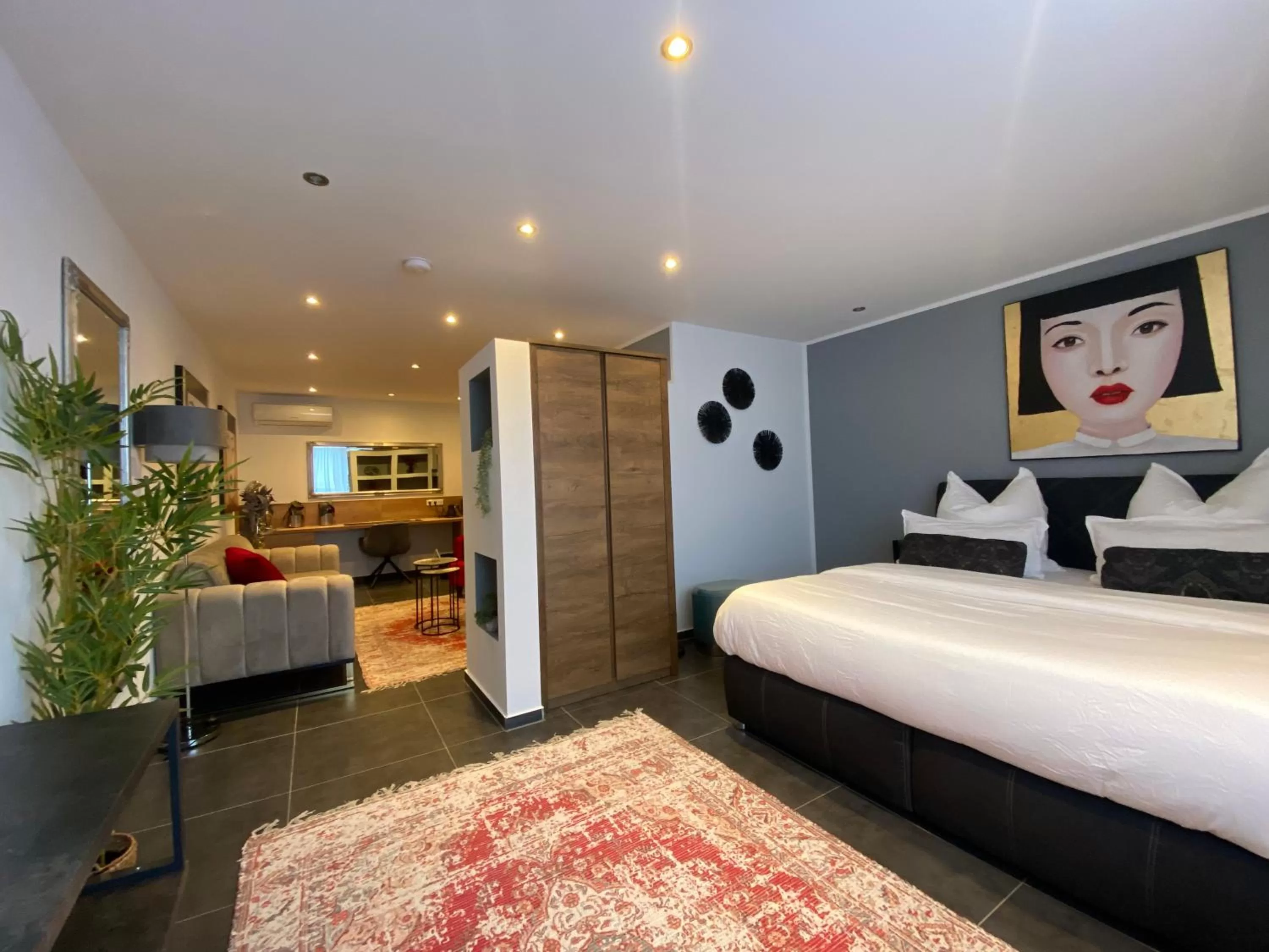 Bed in MARRAM Suitehotel