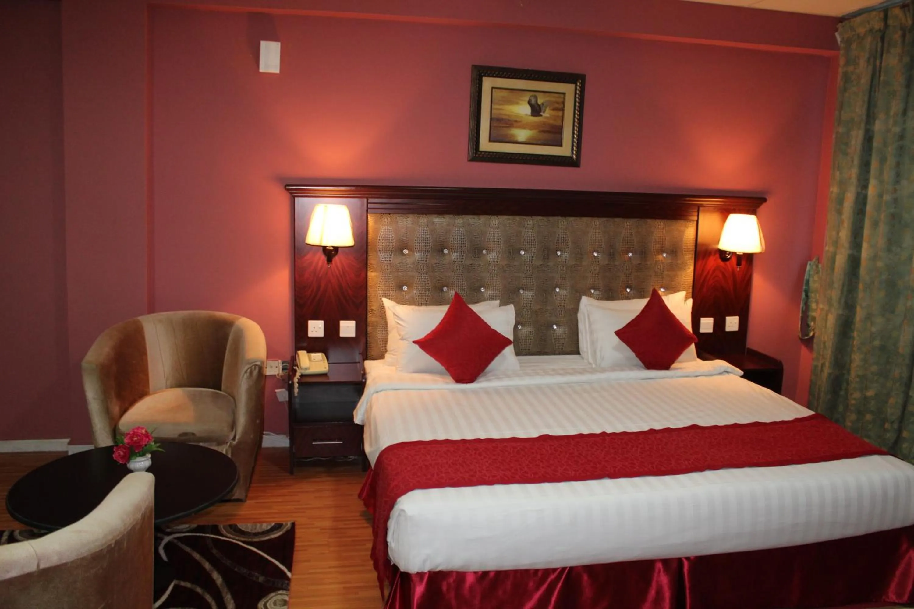 Bed in Grand Nova Hotel