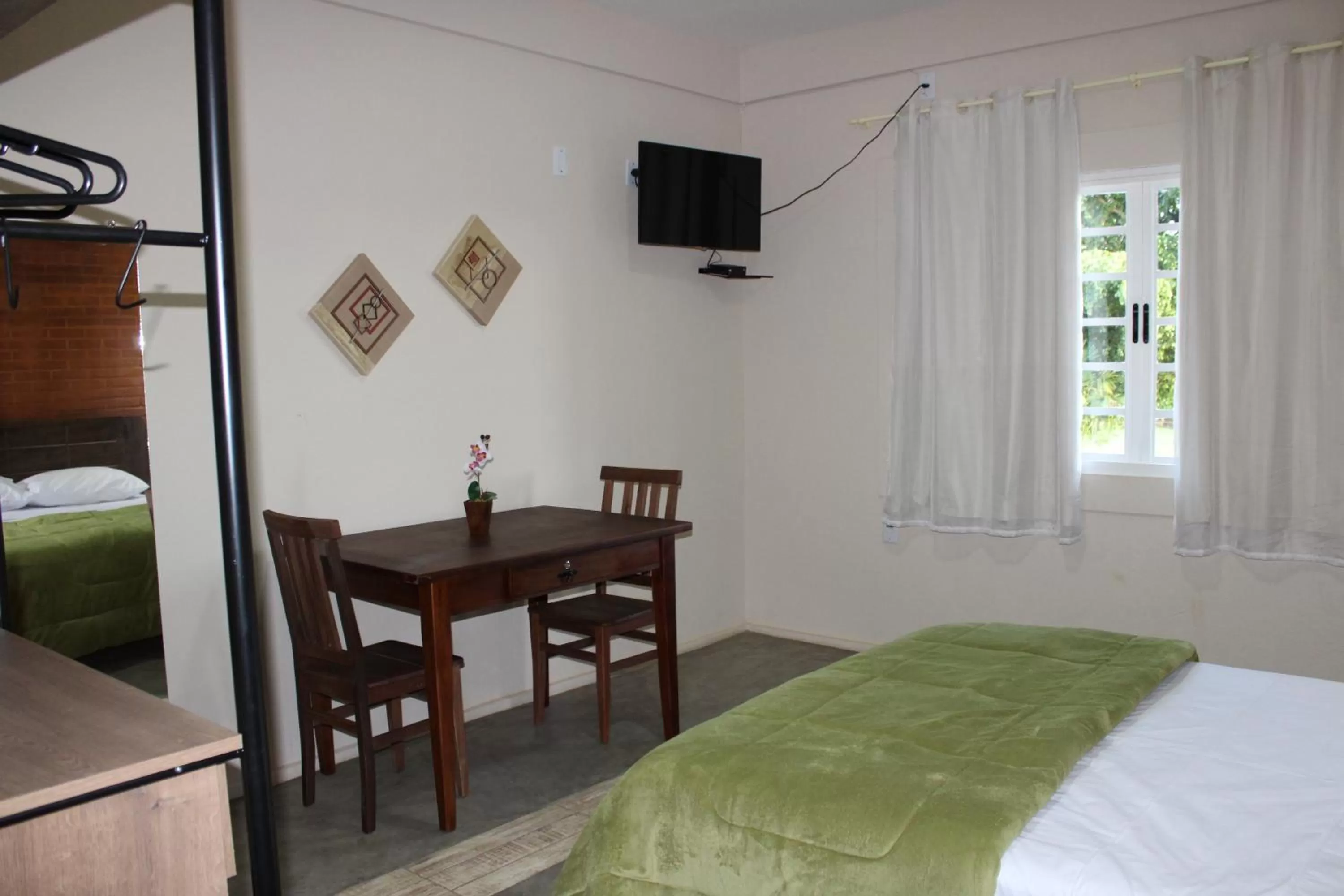 Bed in Pousada Morro dos Ventos