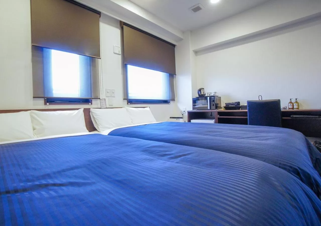 Bed in HOTEL LiVEMAX Kanazawa Ekimae