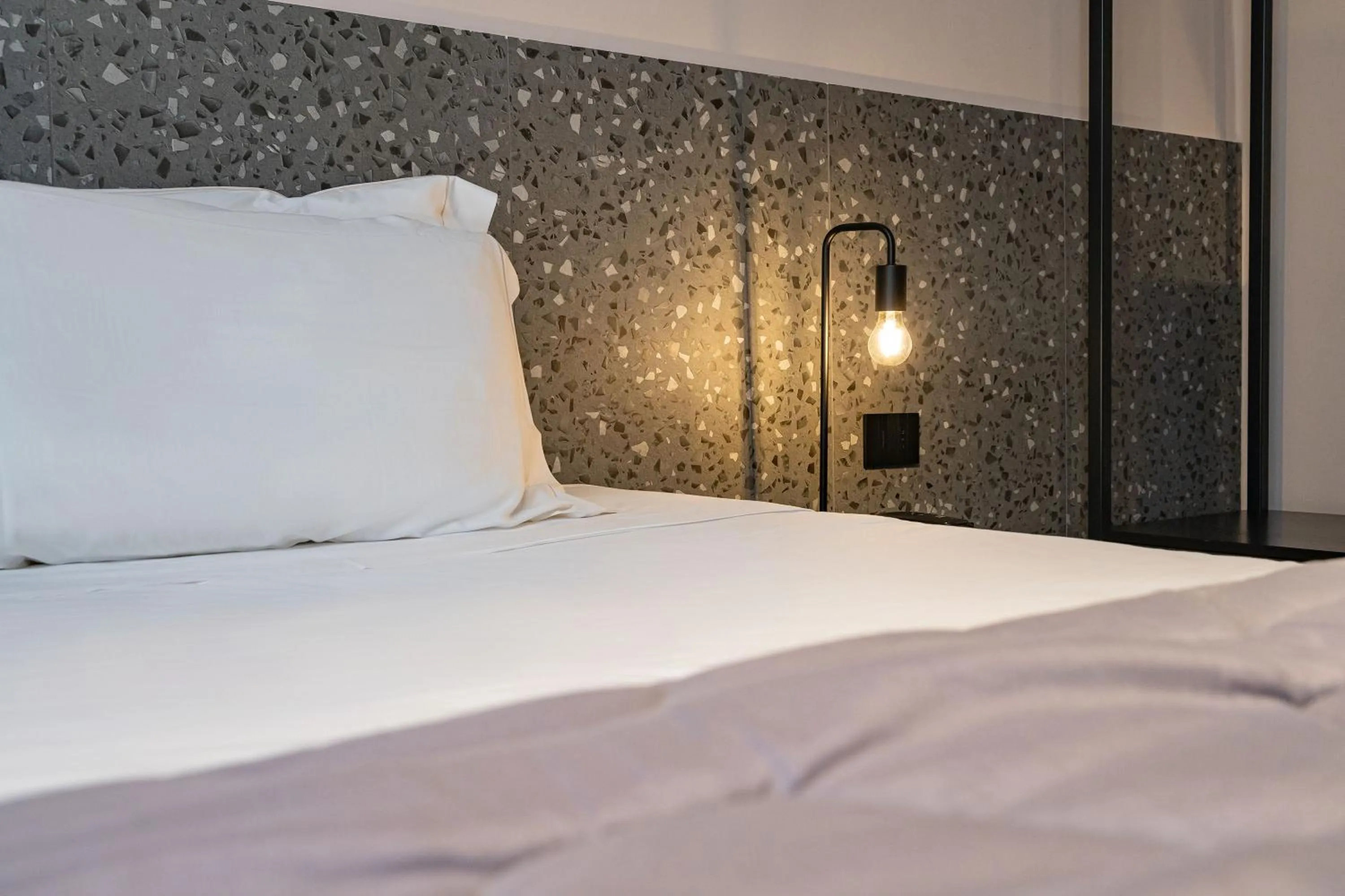 Bed in Elide Design Hotel