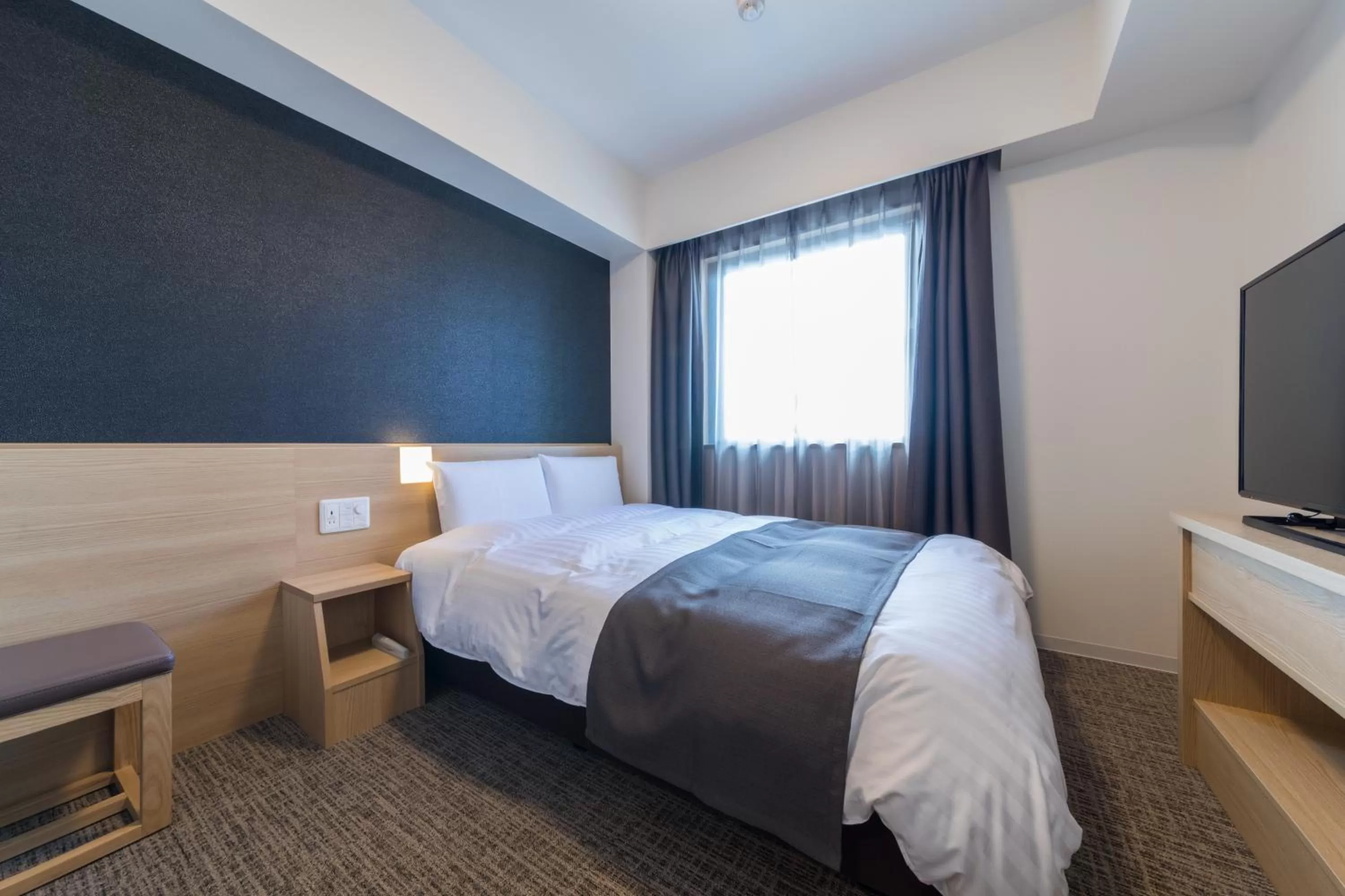 Photo of the whole room, Bed in Dormy Inn Matsuyama Natural Hot Spring