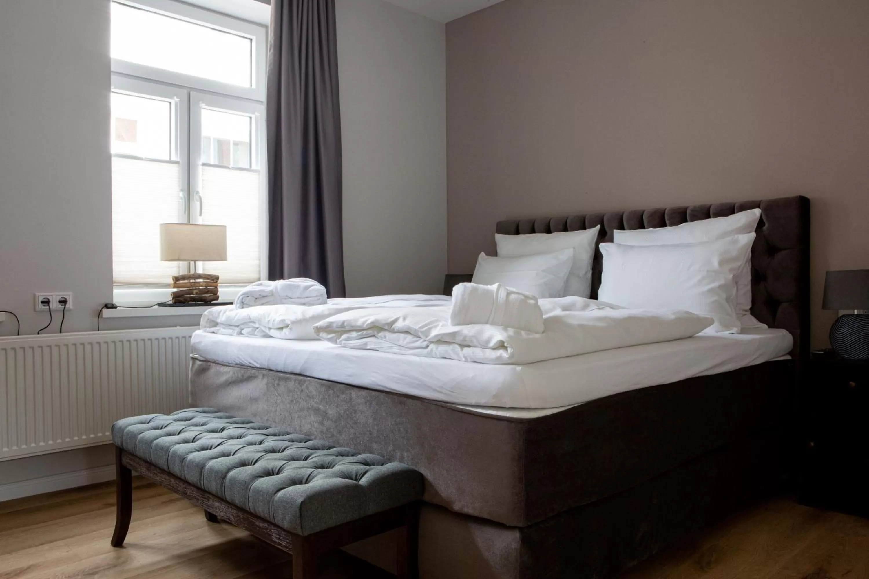 Bed in Romantik Hotel Aquarium