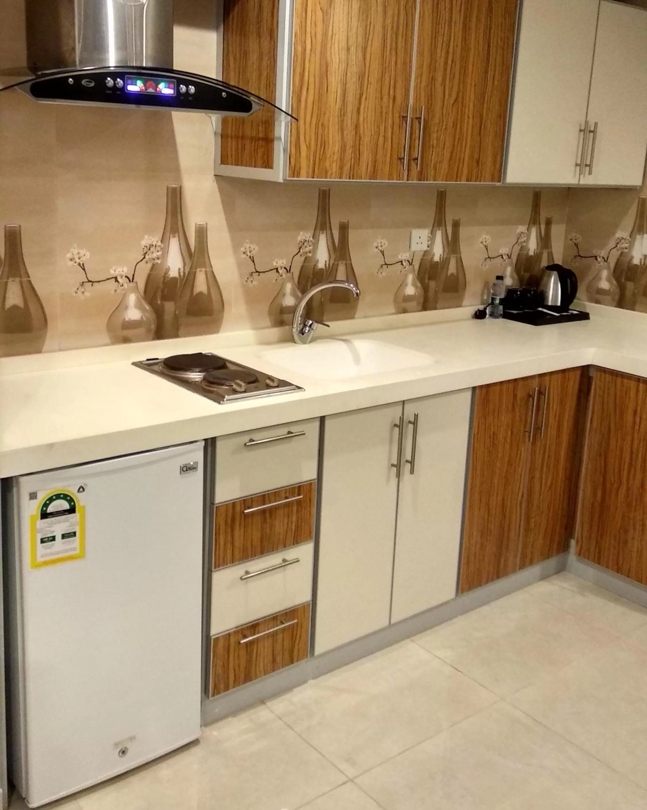 Kitchen or kitchenette in يان للشقق المخدومة - Yan Apartments