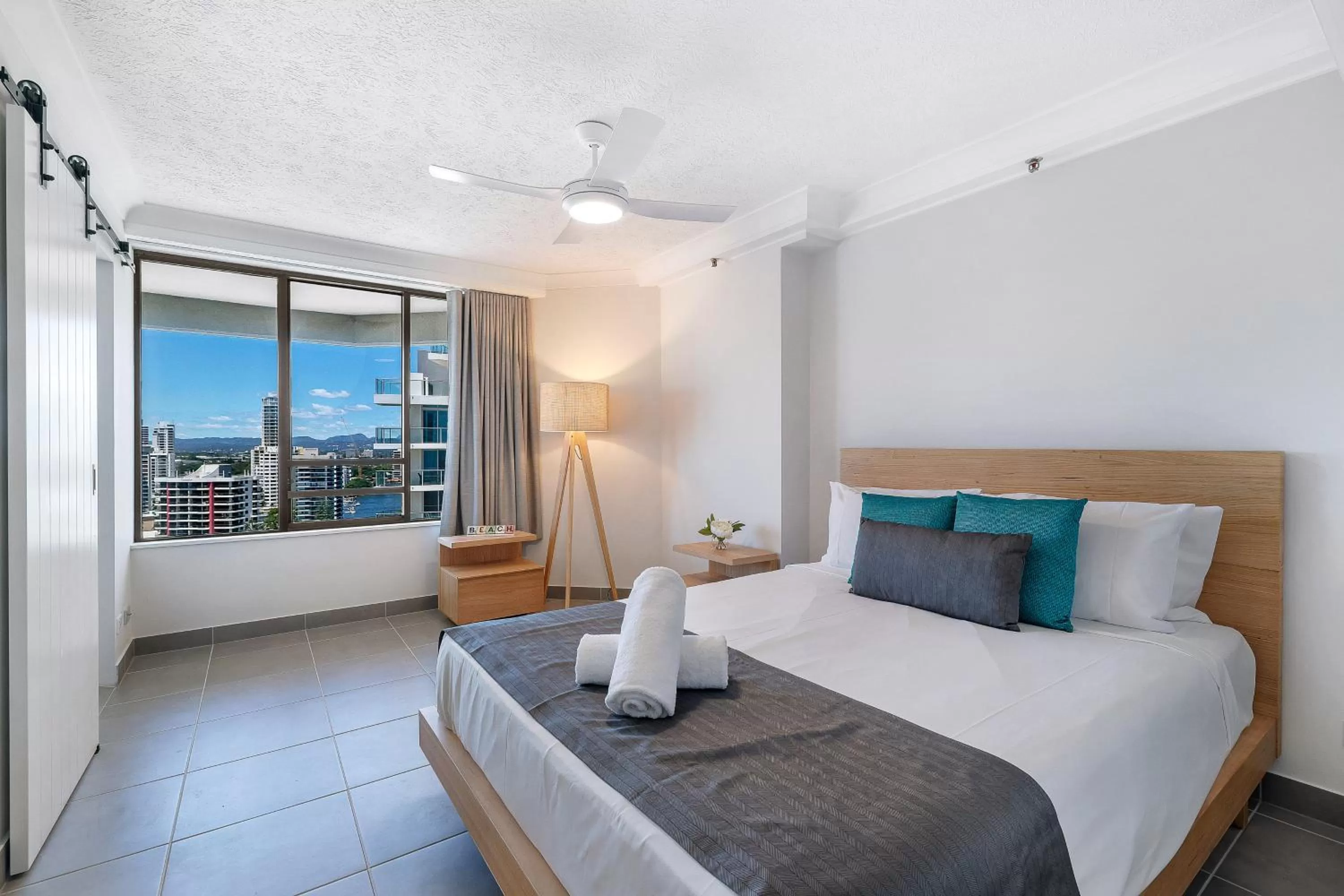 Bed in Surfers Century Oceanside Apartments