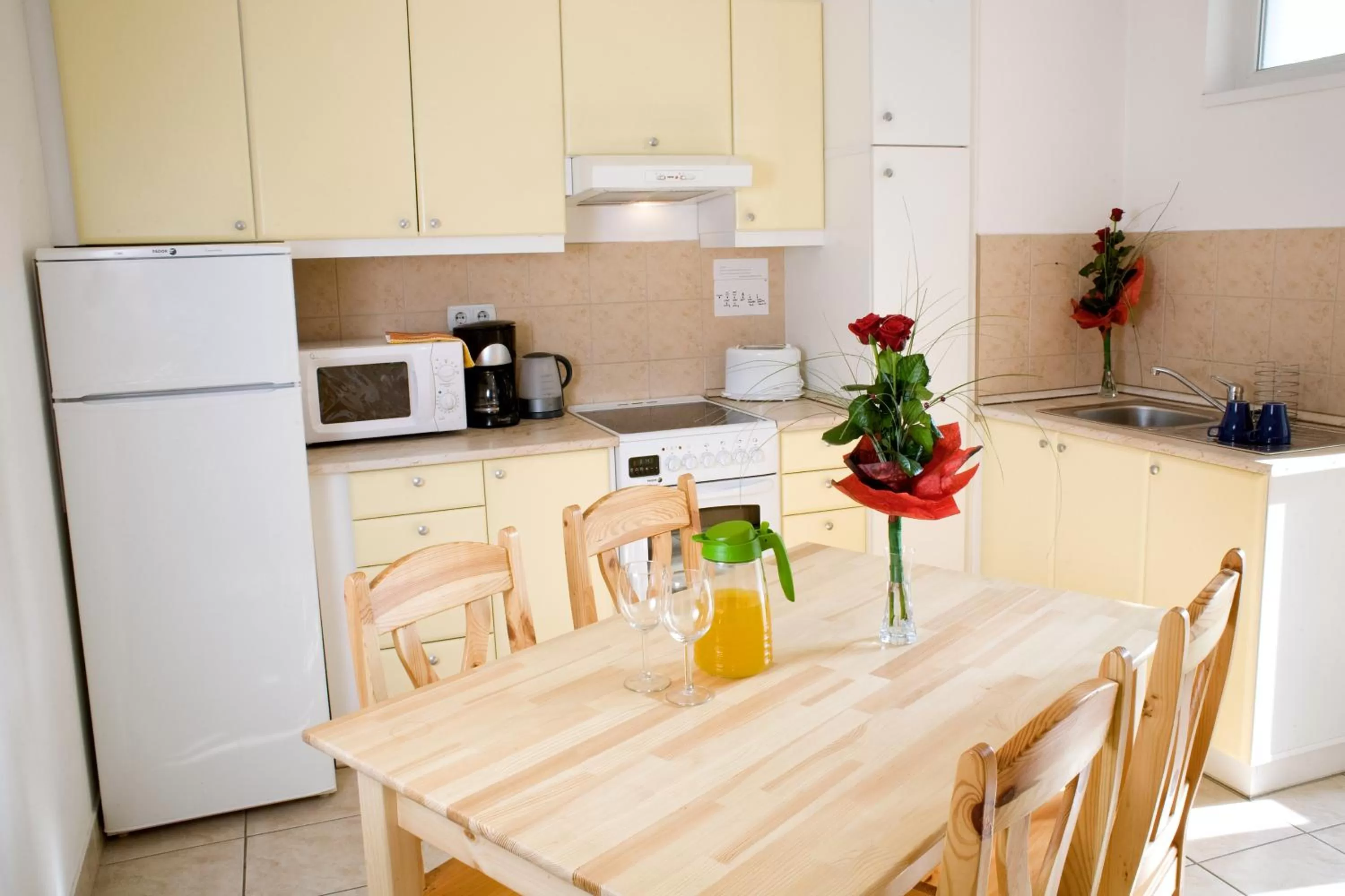 Kitchen or kitchenette in Agape Apartments