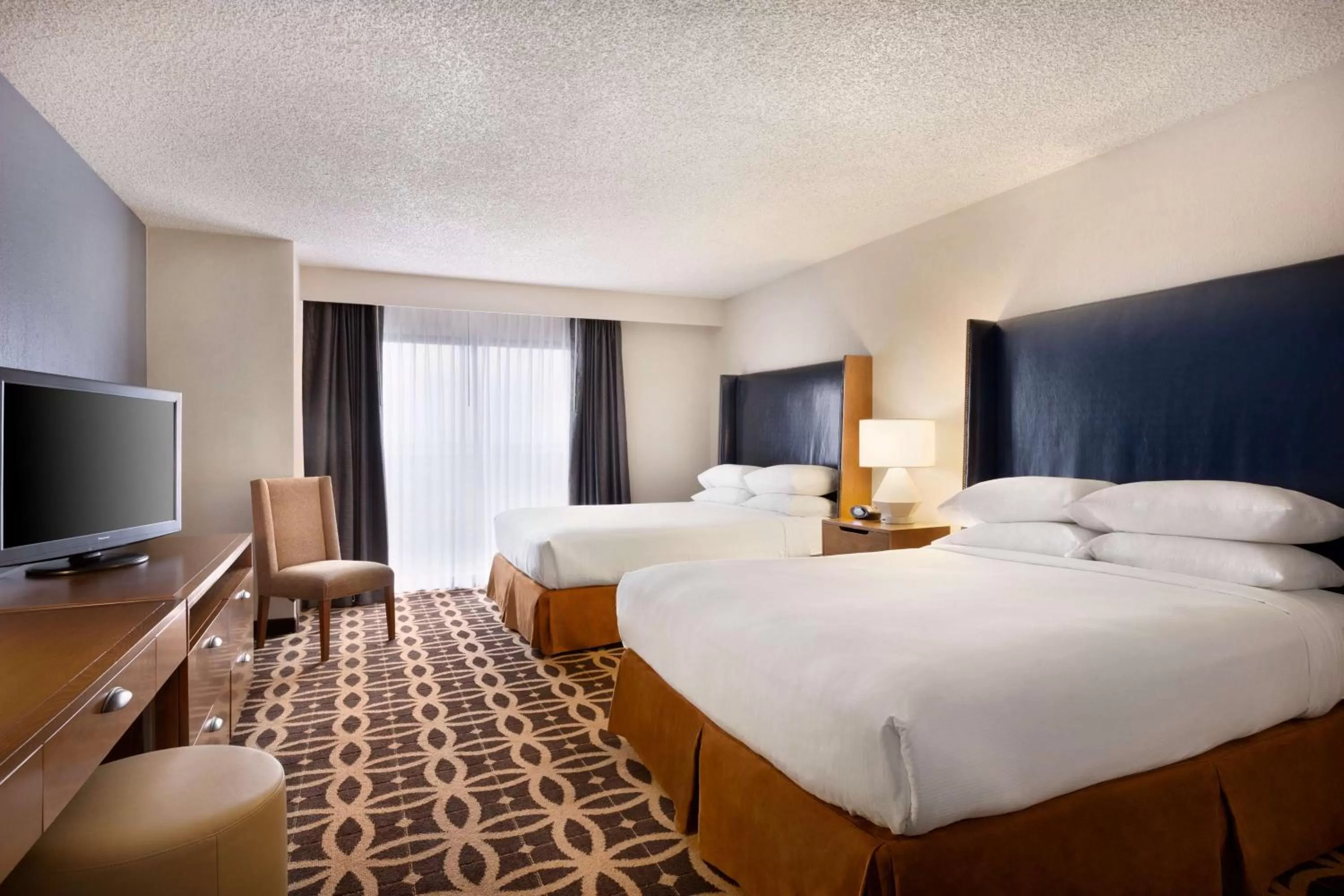 Bed in Embassy Suites by Hilton Dallas DFW Airport South