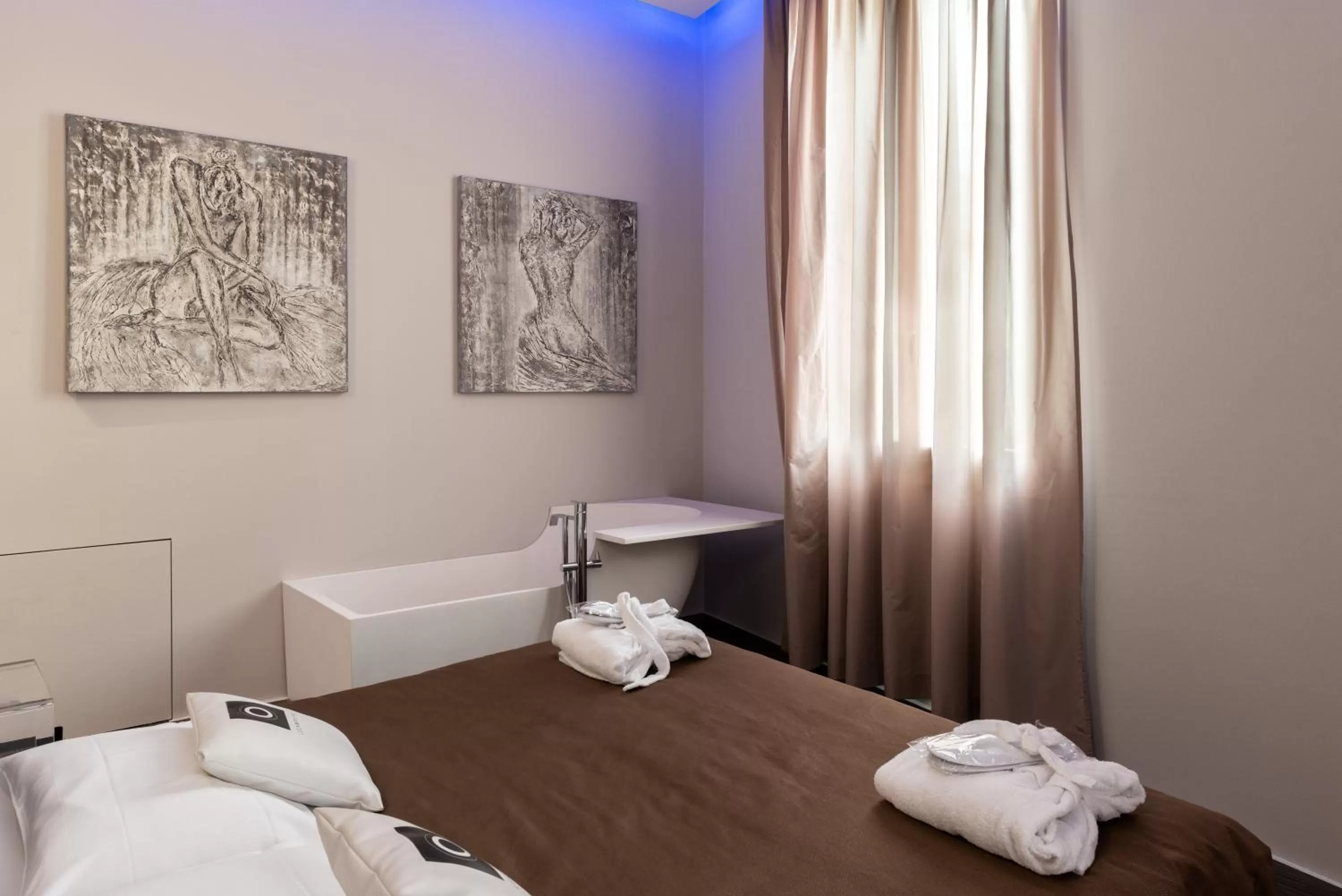 Bed in Le Camp Suite & Spa