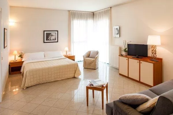 Bed in Cosmo Hotel Torri