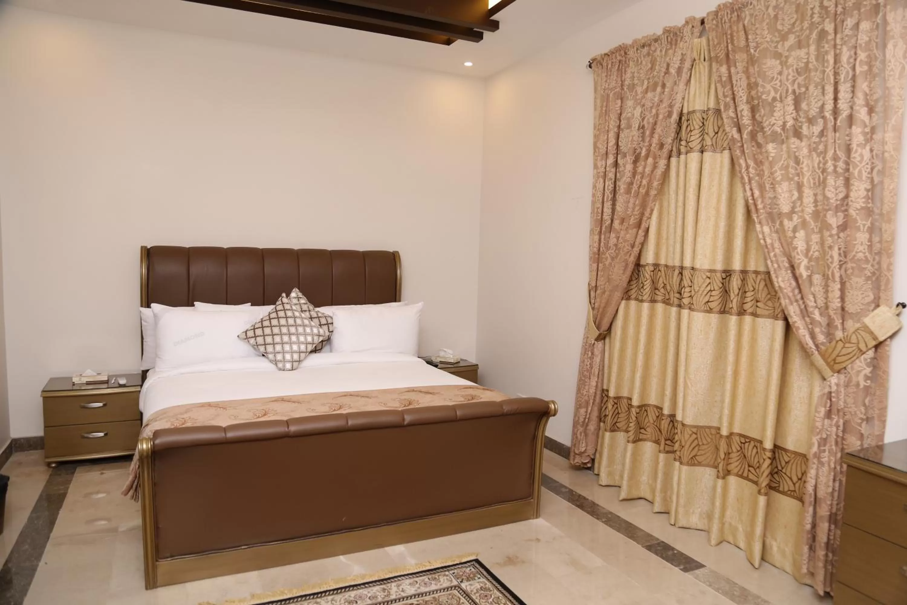 Bed in Zifan Hotel & Suites