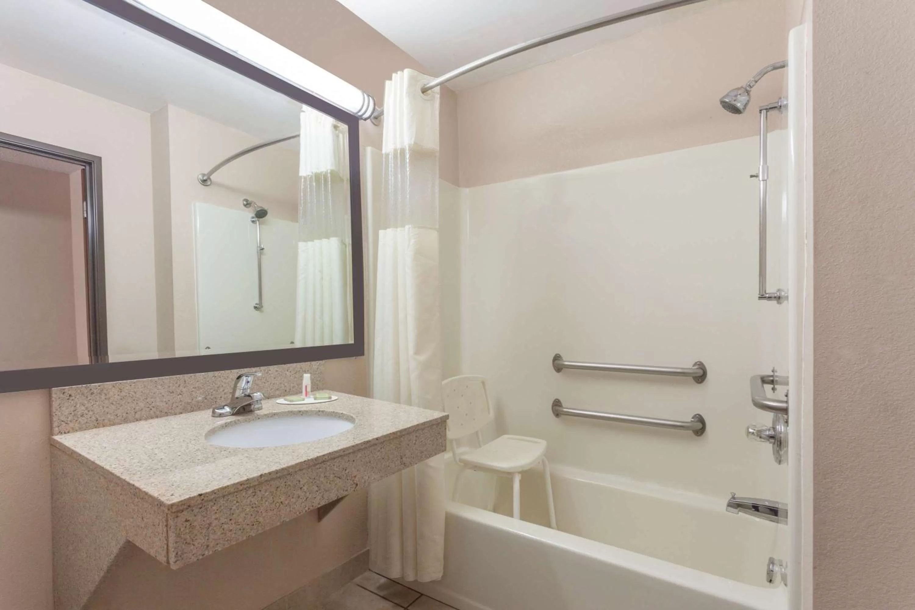Bathroom in Super 8 by Wyndham Carrollton