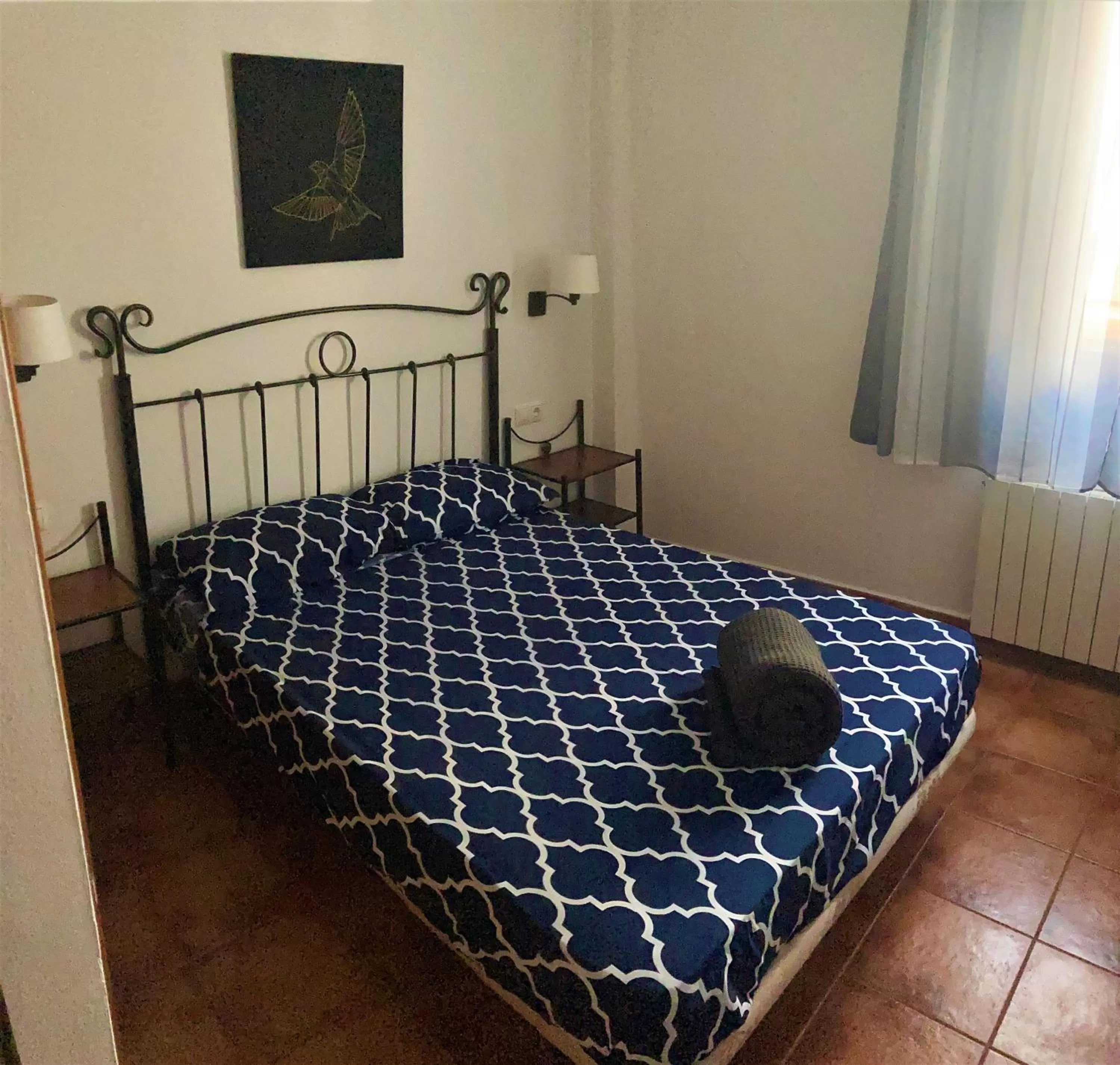 Bed in APARTAMENTOS CASERIA DE COMARES