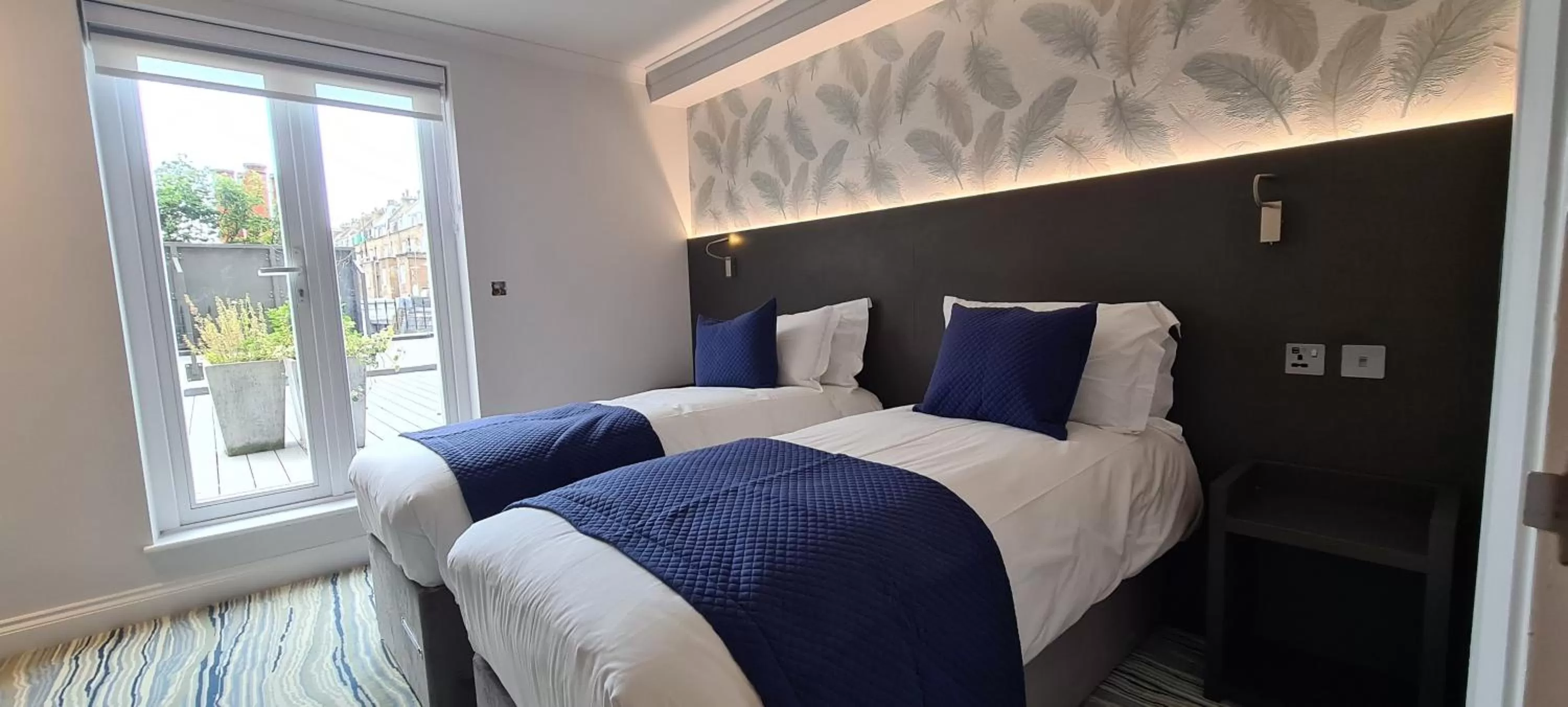 Bed in Commodore Hotel