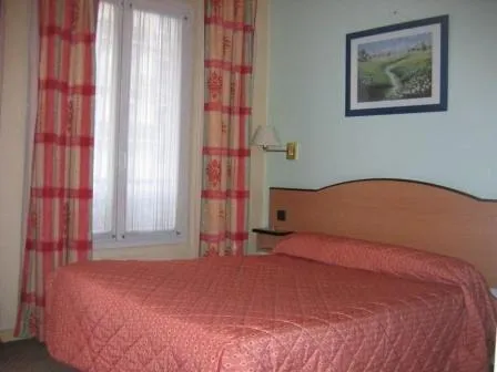 Bed in Hotel Ferney République