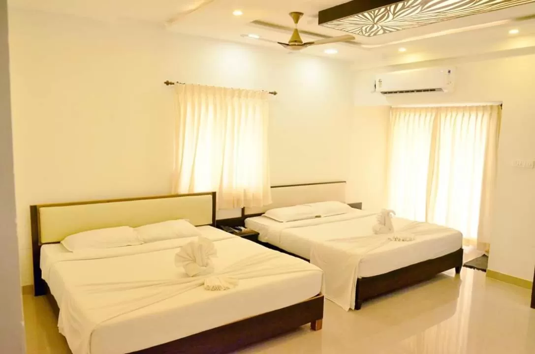 Bed in Hotel Ambai Grand