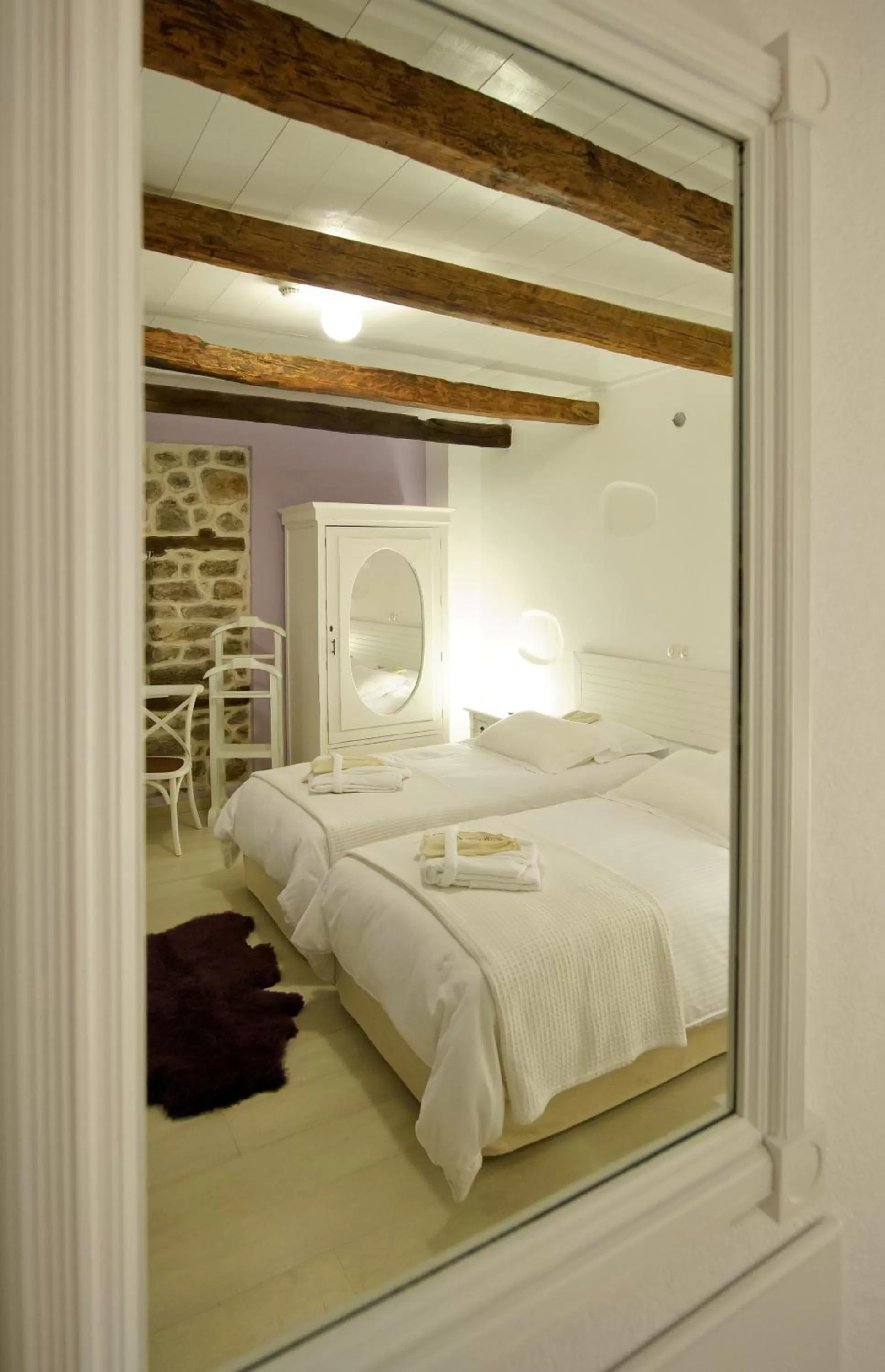 Bed in Orologopoulos Mansion Luxury Hotel