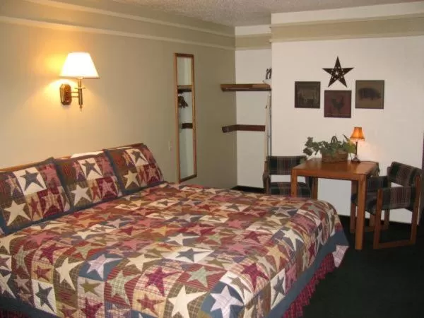 Bed in Covered Wagon Motel Lusk WY