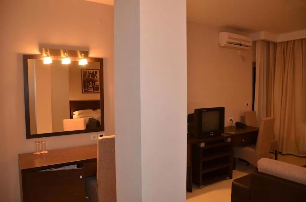 Living room, Bed in Hotel Golf Luxury