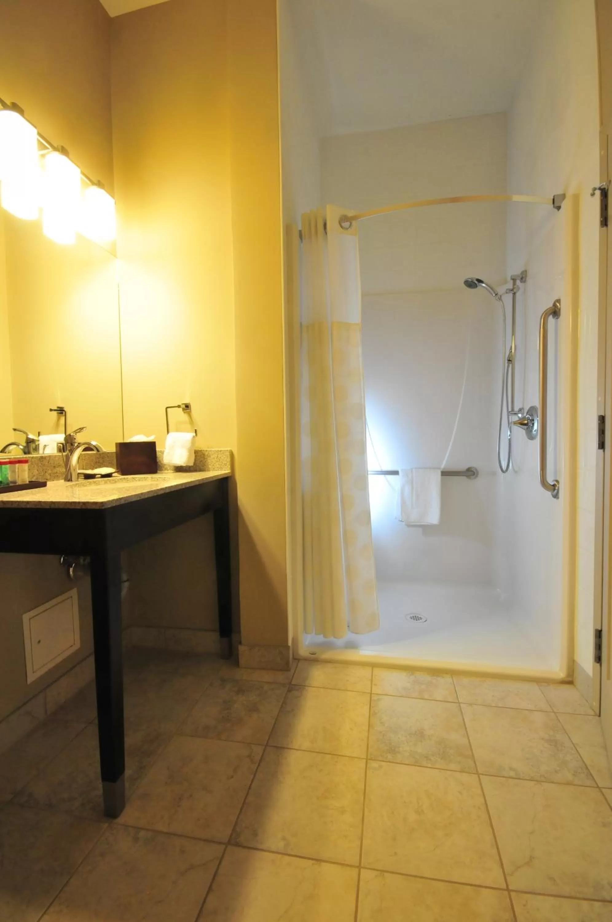 Bathroom in Ramada by Wyndham Emerald Park/Regina East