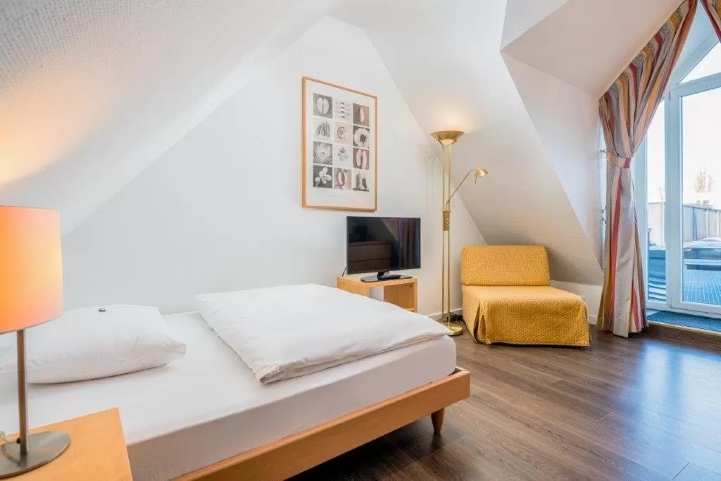 Photo of the whole room, Bed in Hotel Am Nockherberg