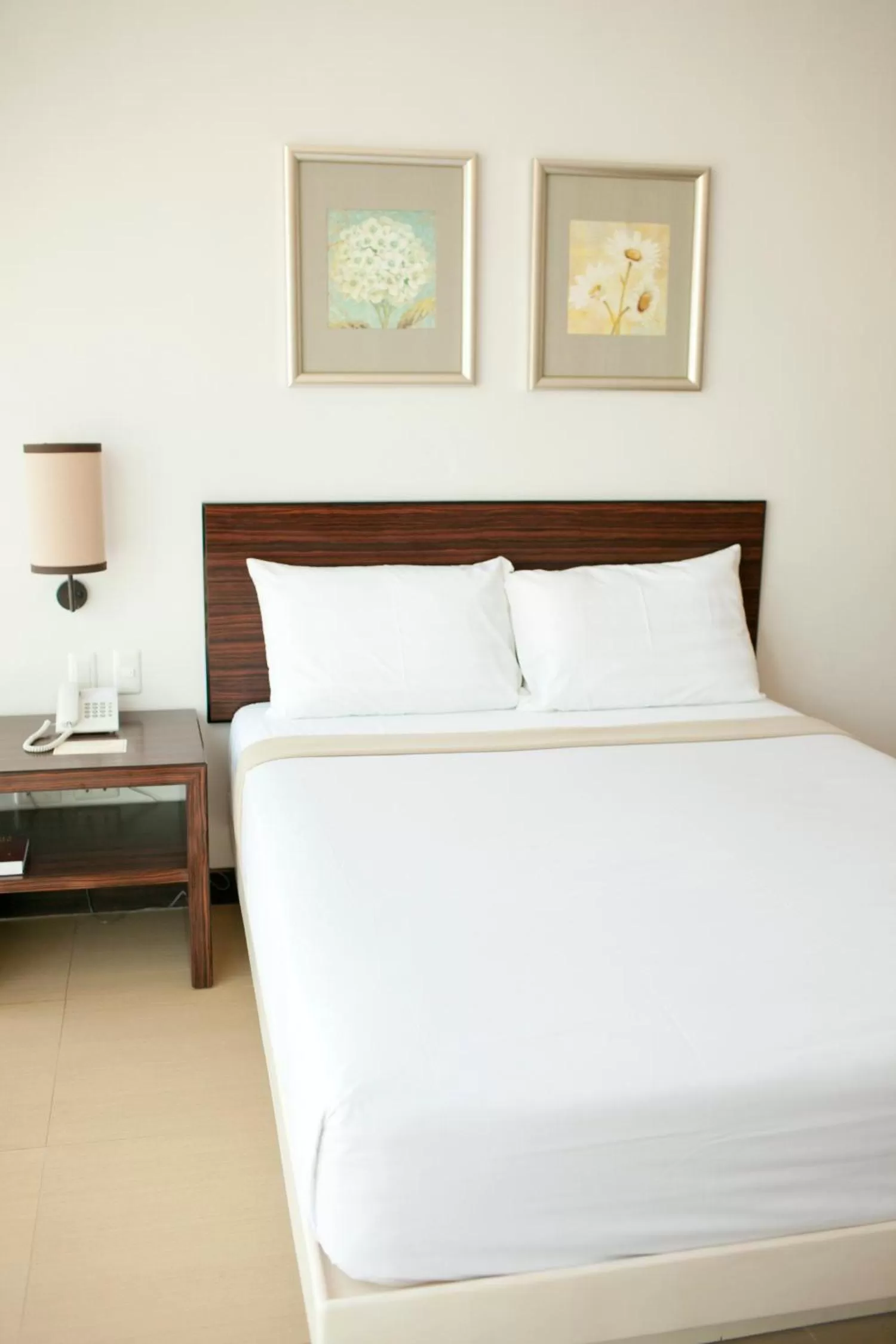 Bed in D'Hotel & Suites