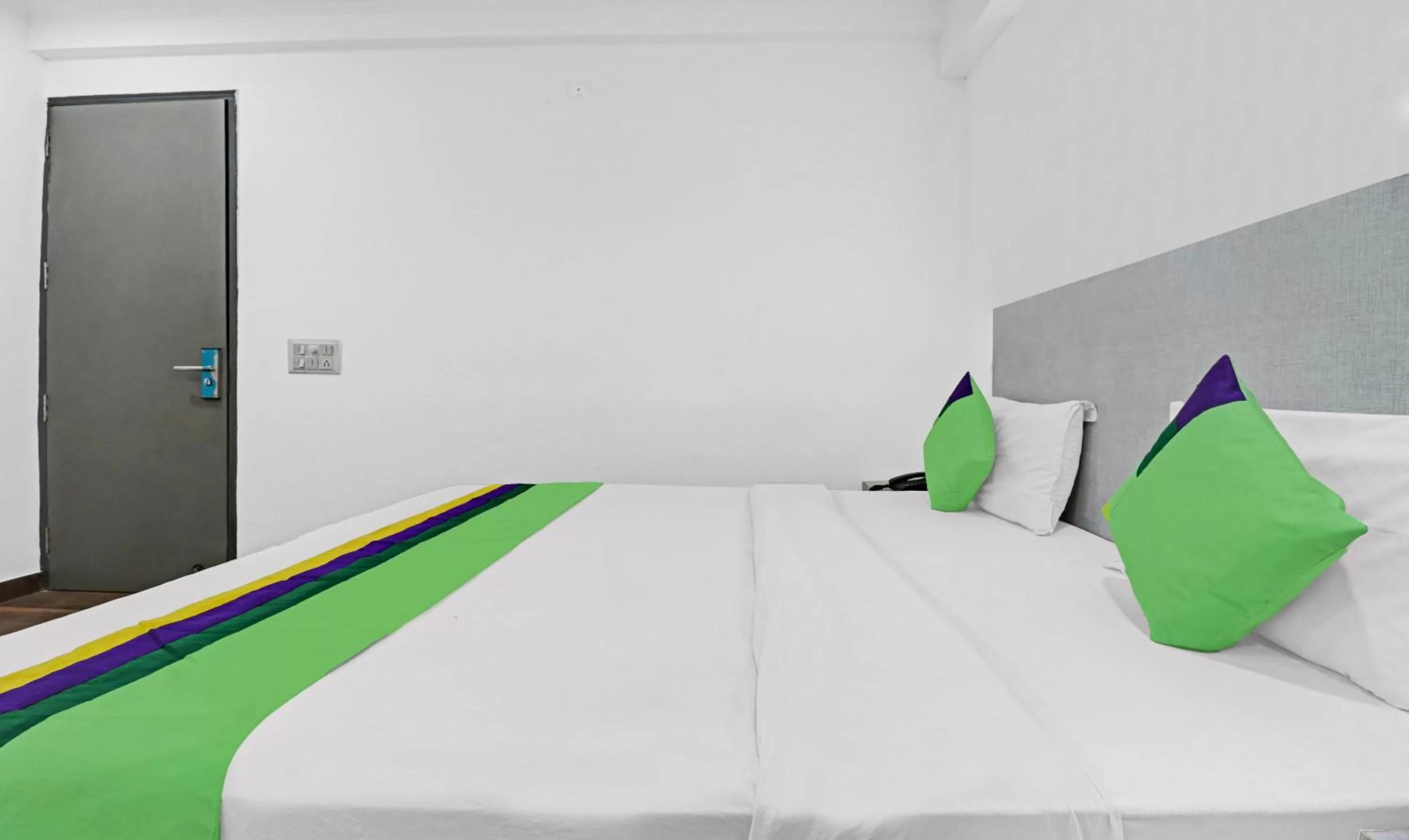 Bedroom, Bed in Treebo Grand Town House