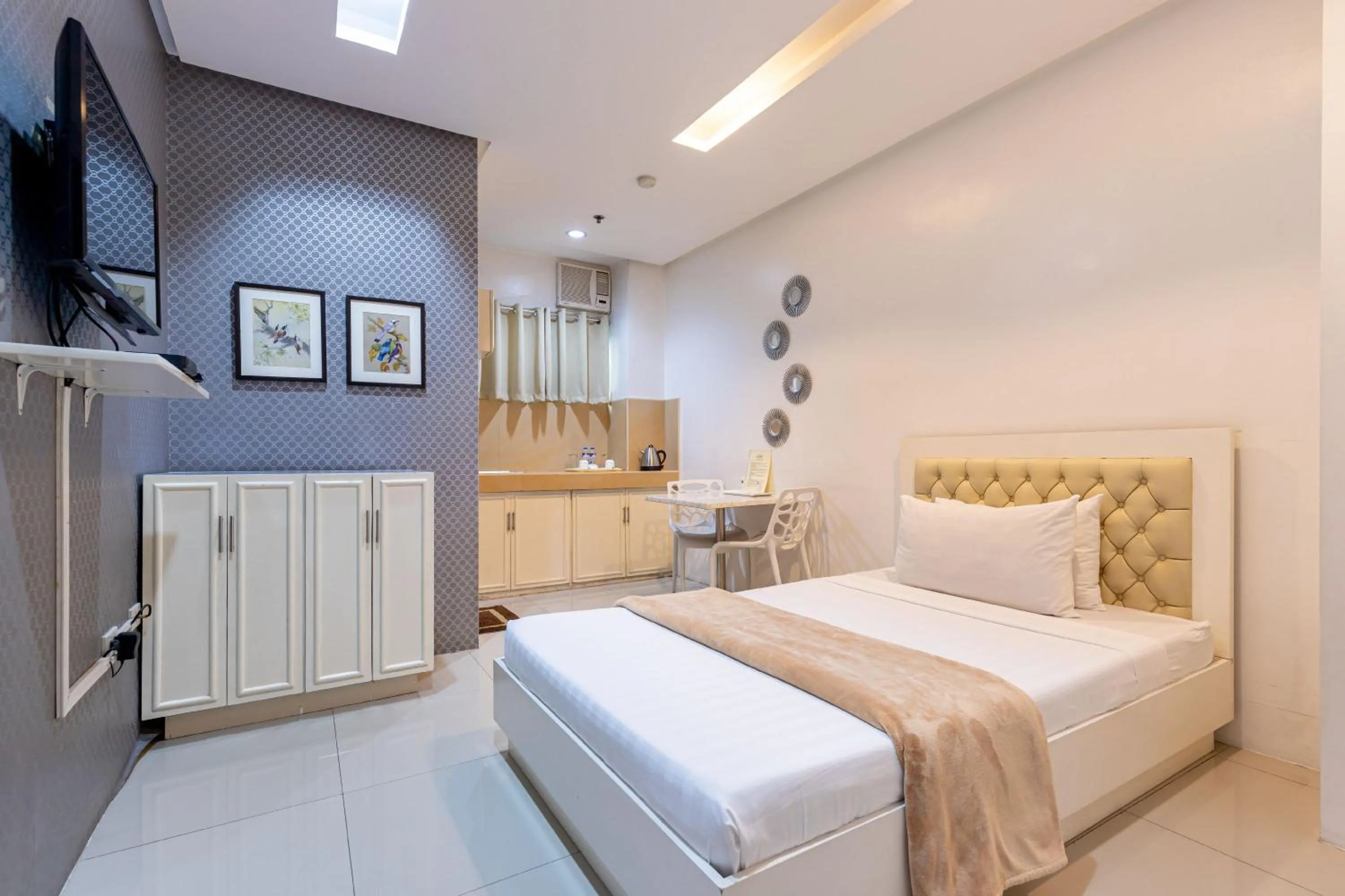 Bed in Baymont Suites & Residences