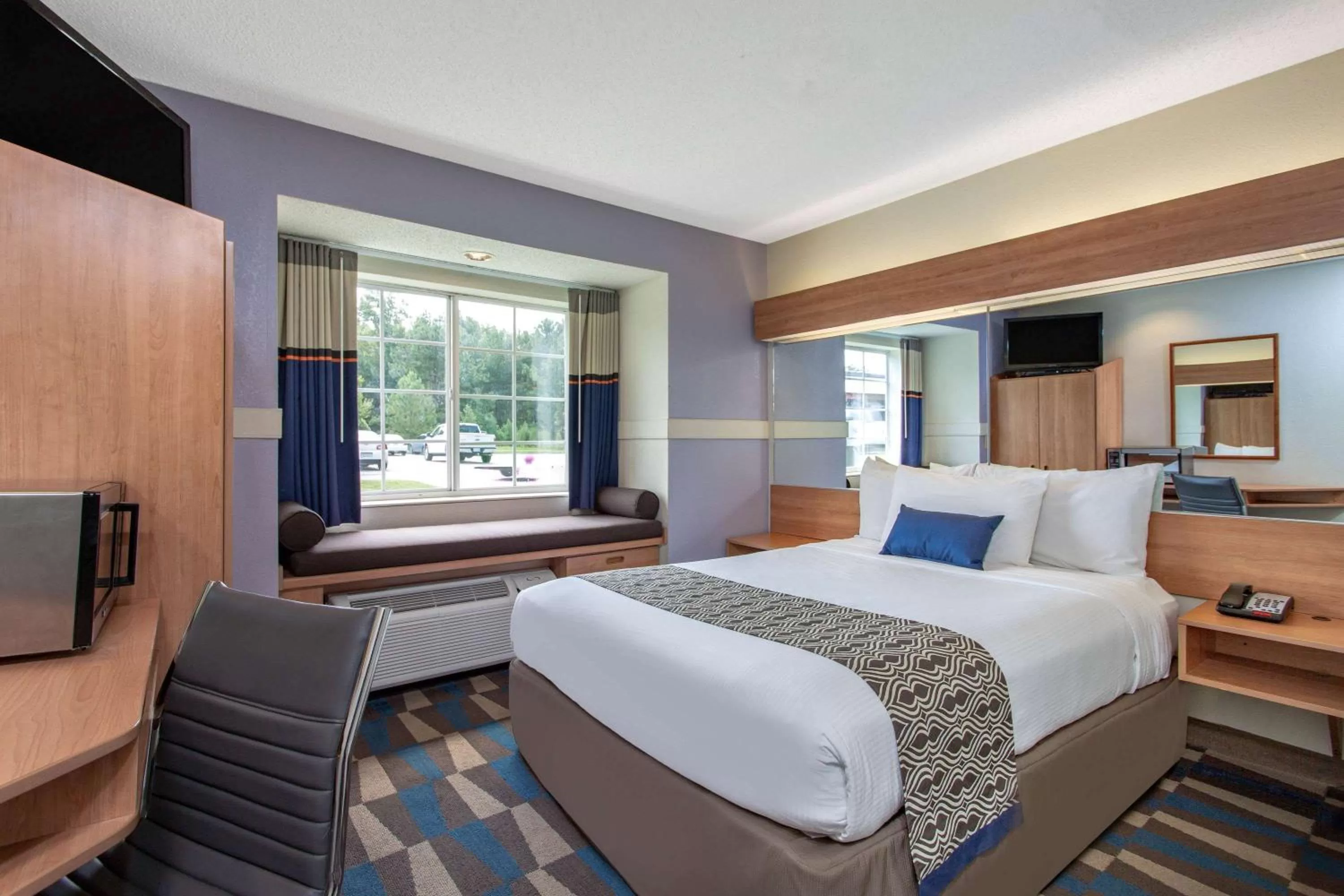 Photo of the whole room, Bed in Microtel Inn & Suites by Wyndham Lillington/Campbell University