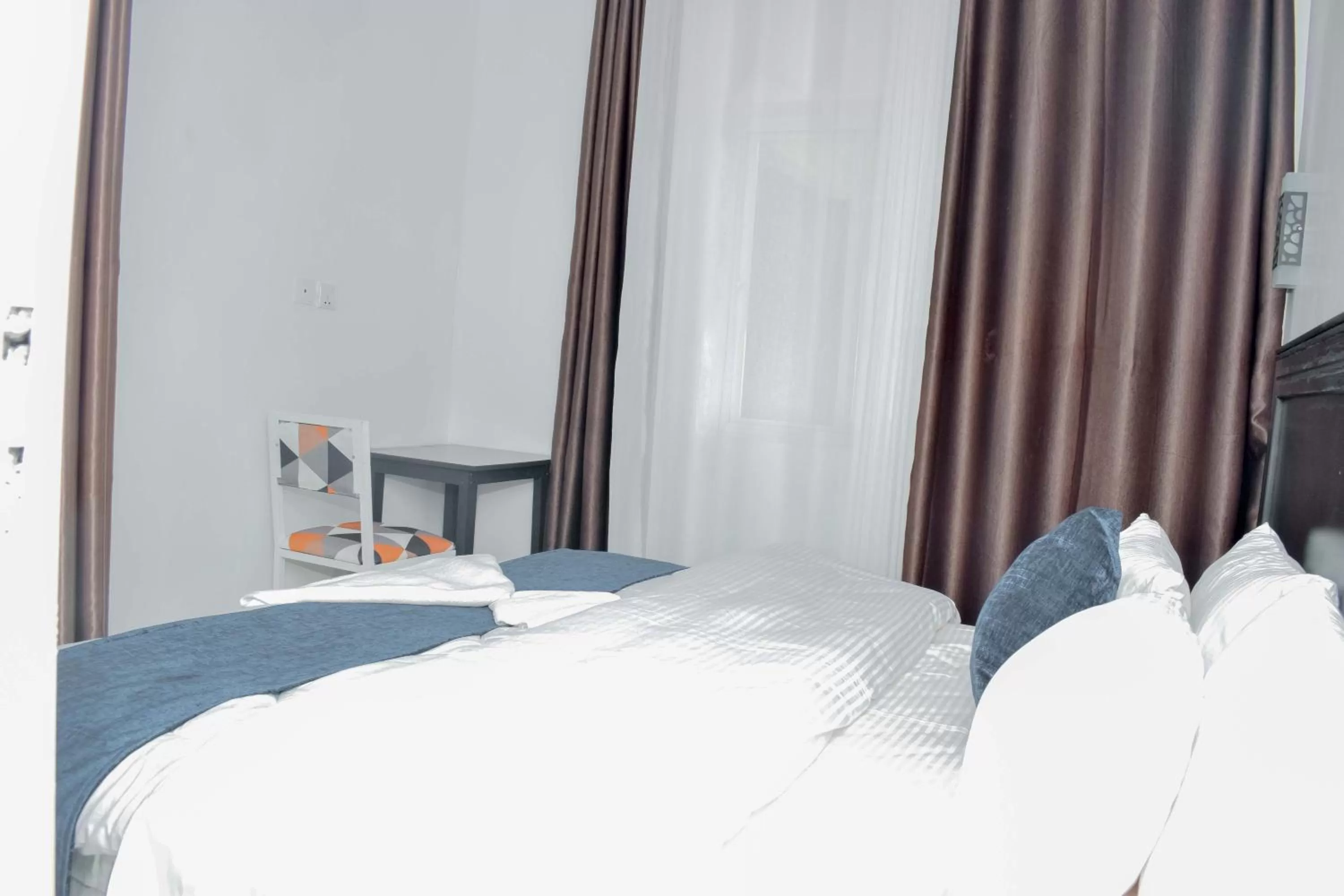 Bed in INZOZI AFRICA HOUSE B&B-Gishushu