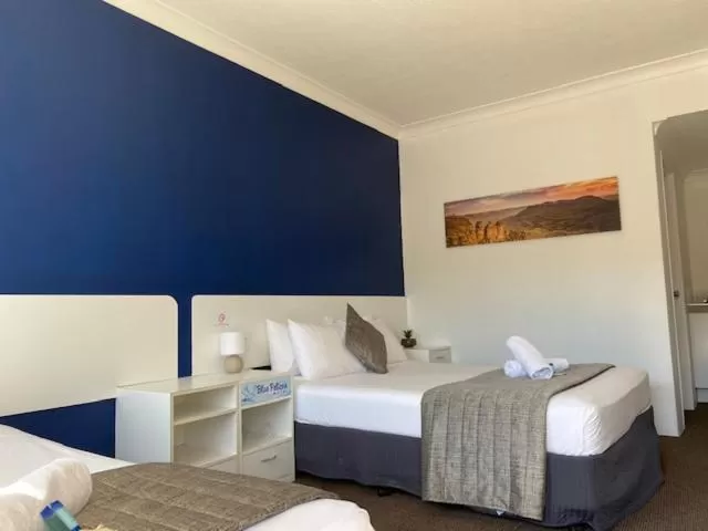 Bed in Blue Pelican Motel