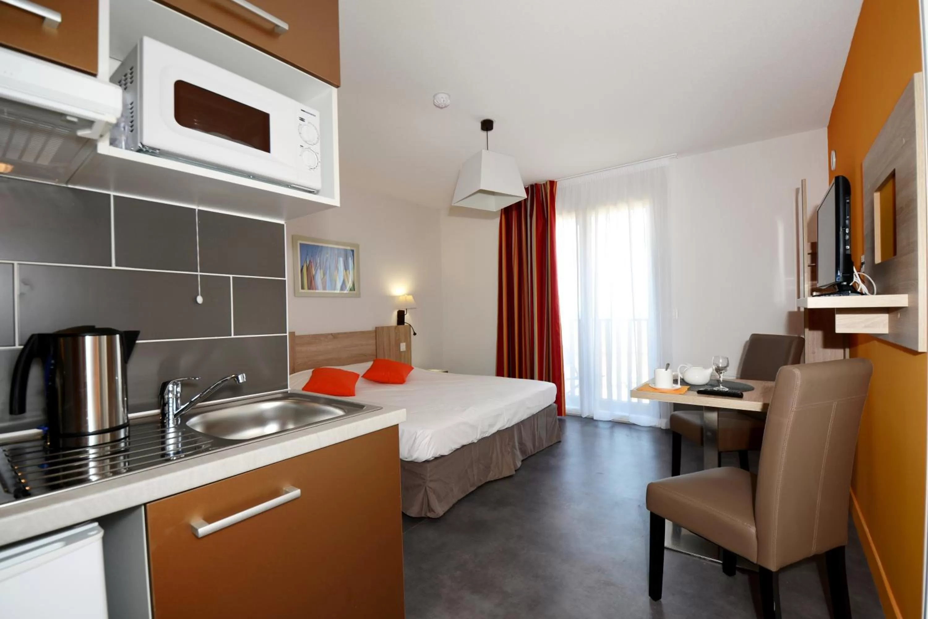 Kitchen or kitchenette, Bed in Résidence Odalys Terra Gaia