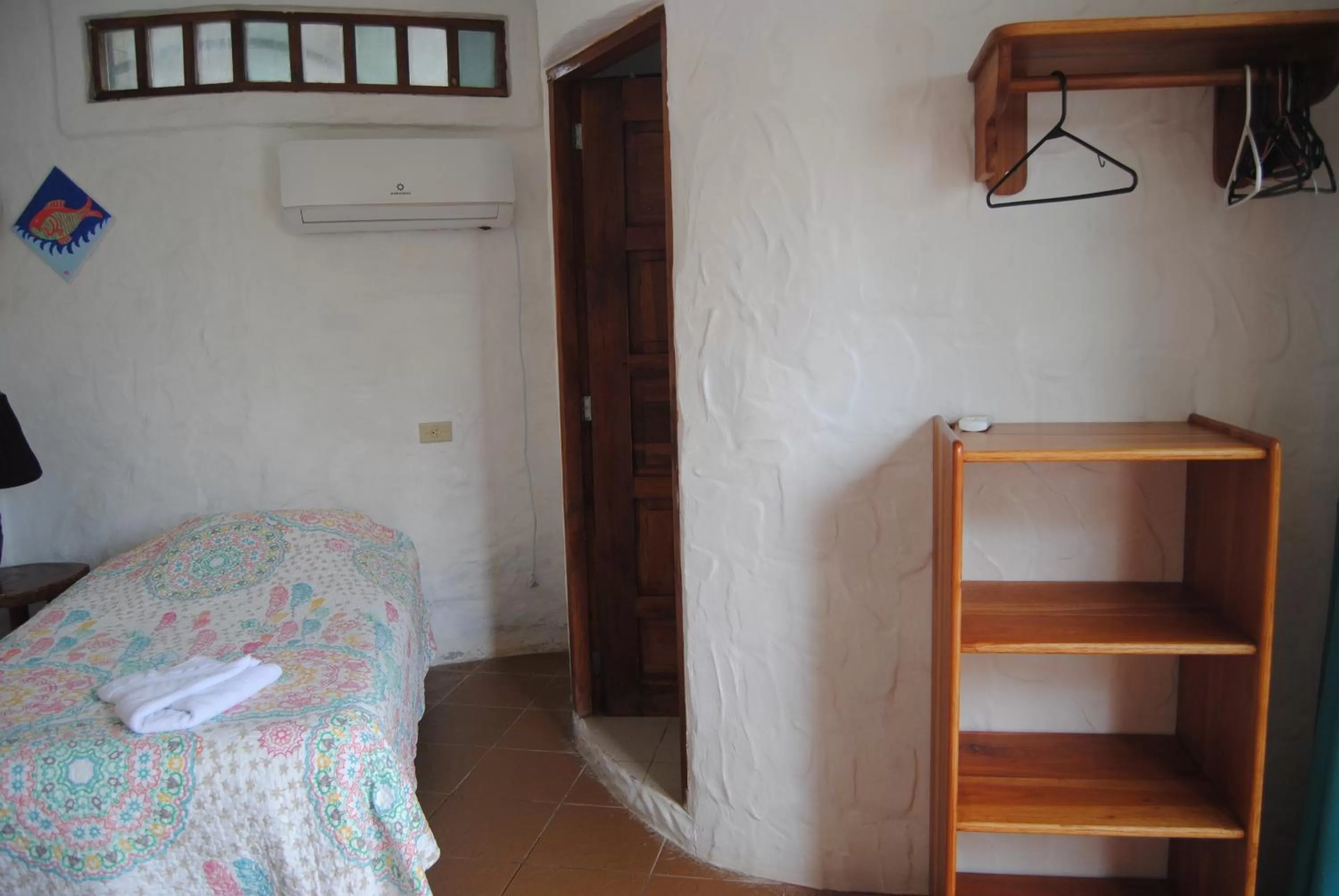 Bed in Hostal Galapagos by Bar de Beto