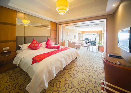 Bed in Huiquan Dynasty Hotel Qingdao