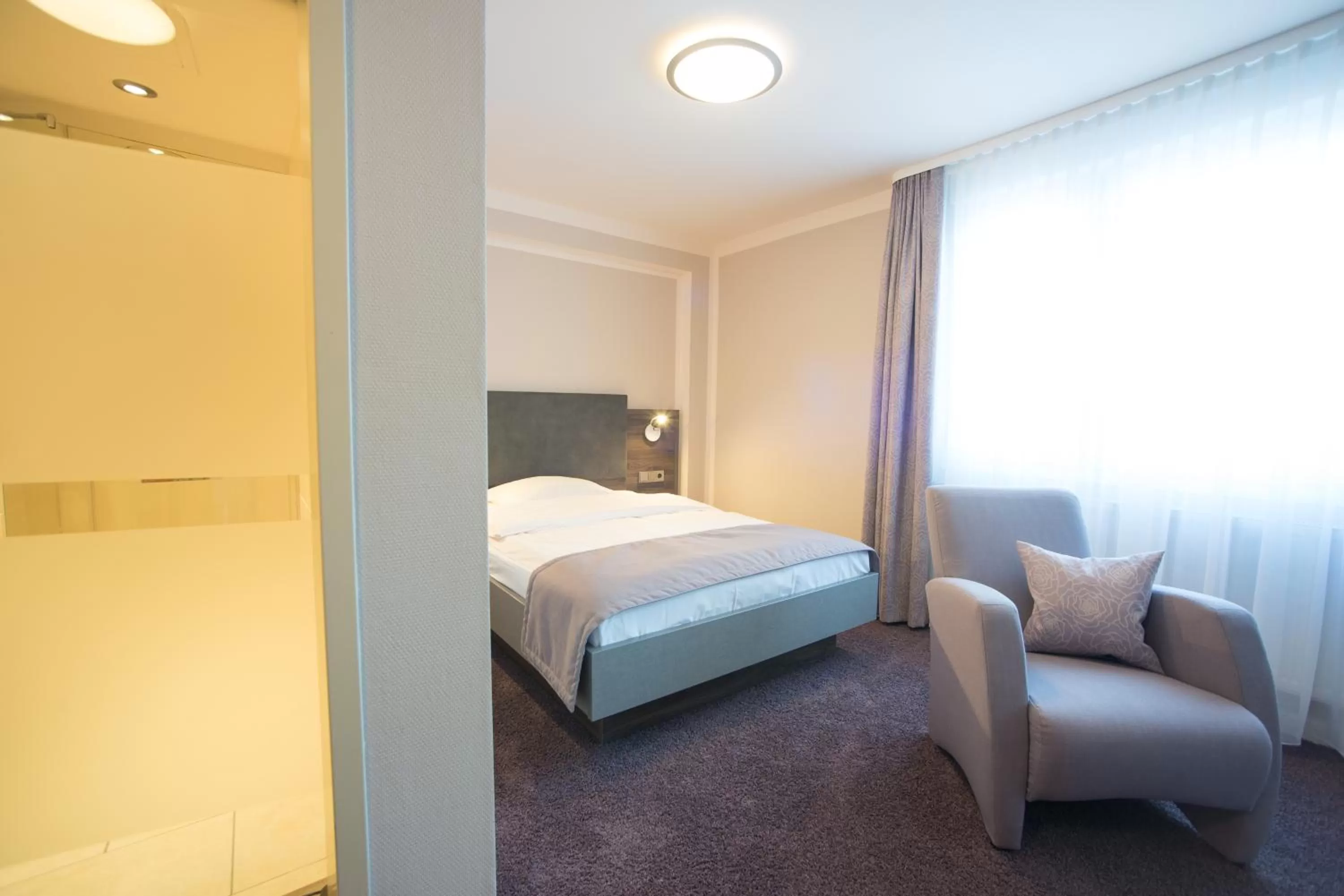 Bed in TRIP INN PostHotel Düren