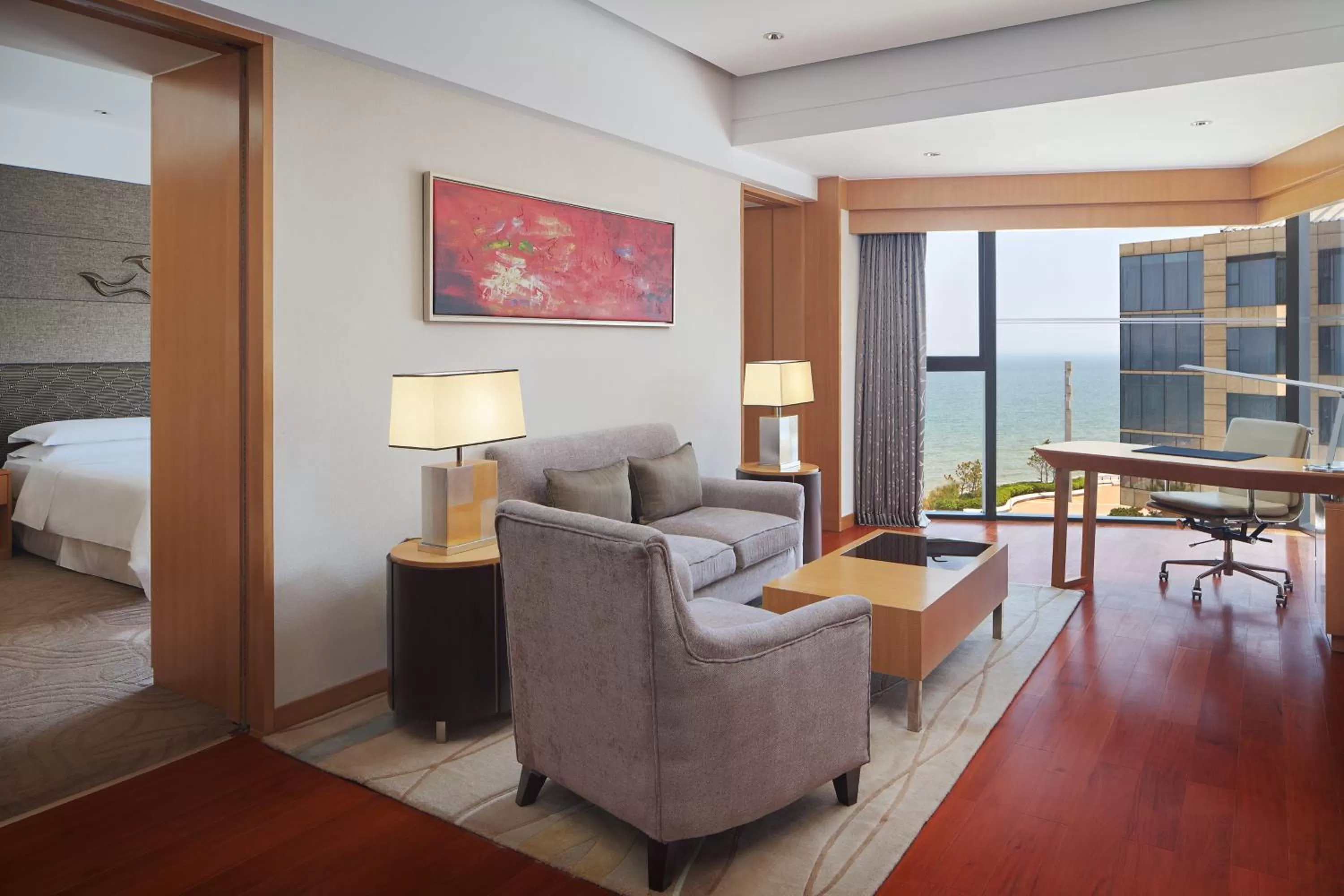 Living room, Bed in Sheraton Yantai Golden Beach Resort