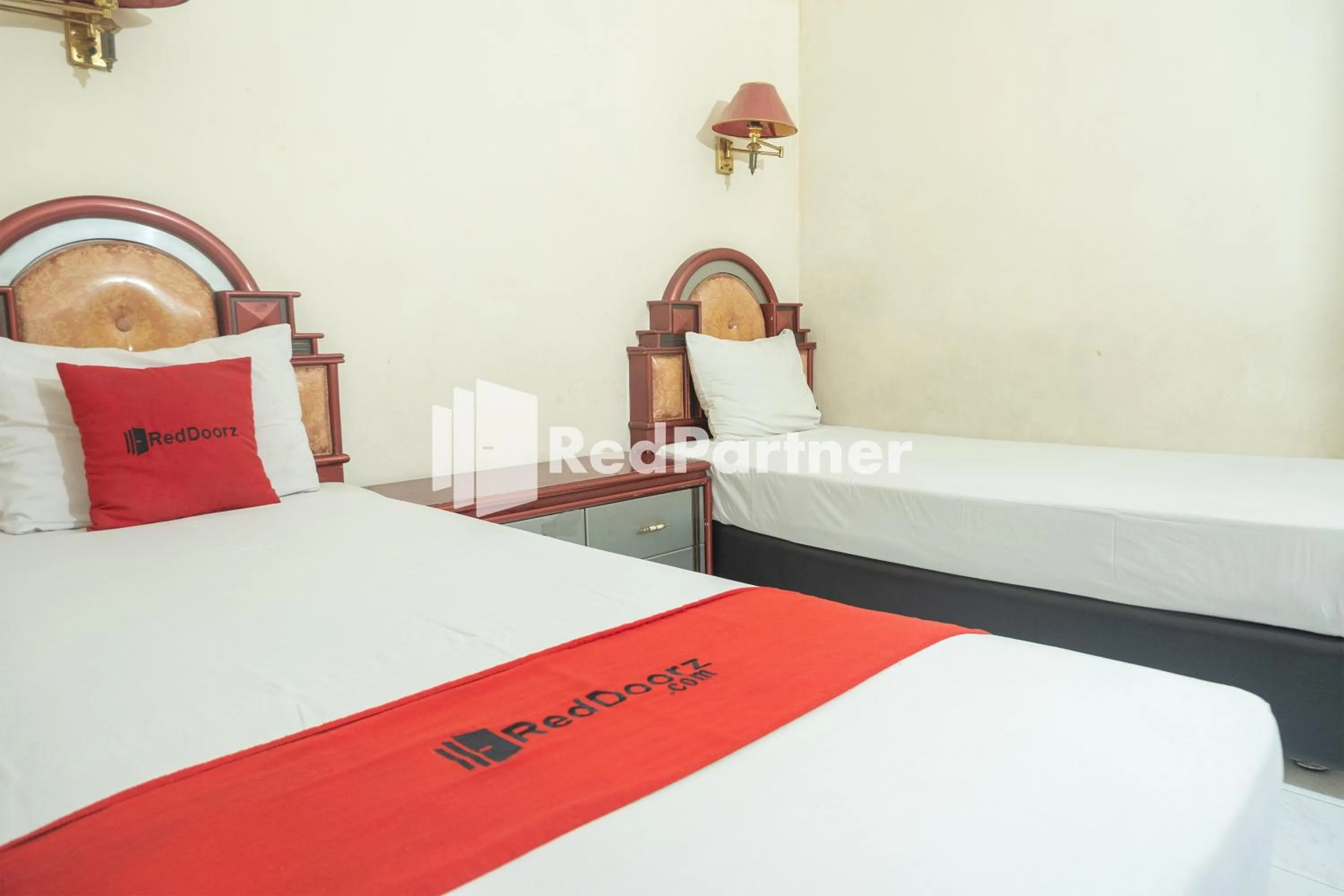 Bed in Akur Hotel Malioboro Mitra RedDoorz