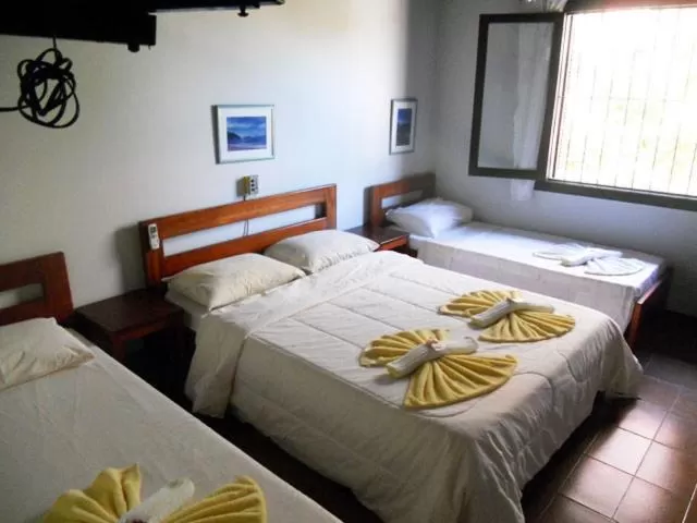 Bed in Pousada Manobra