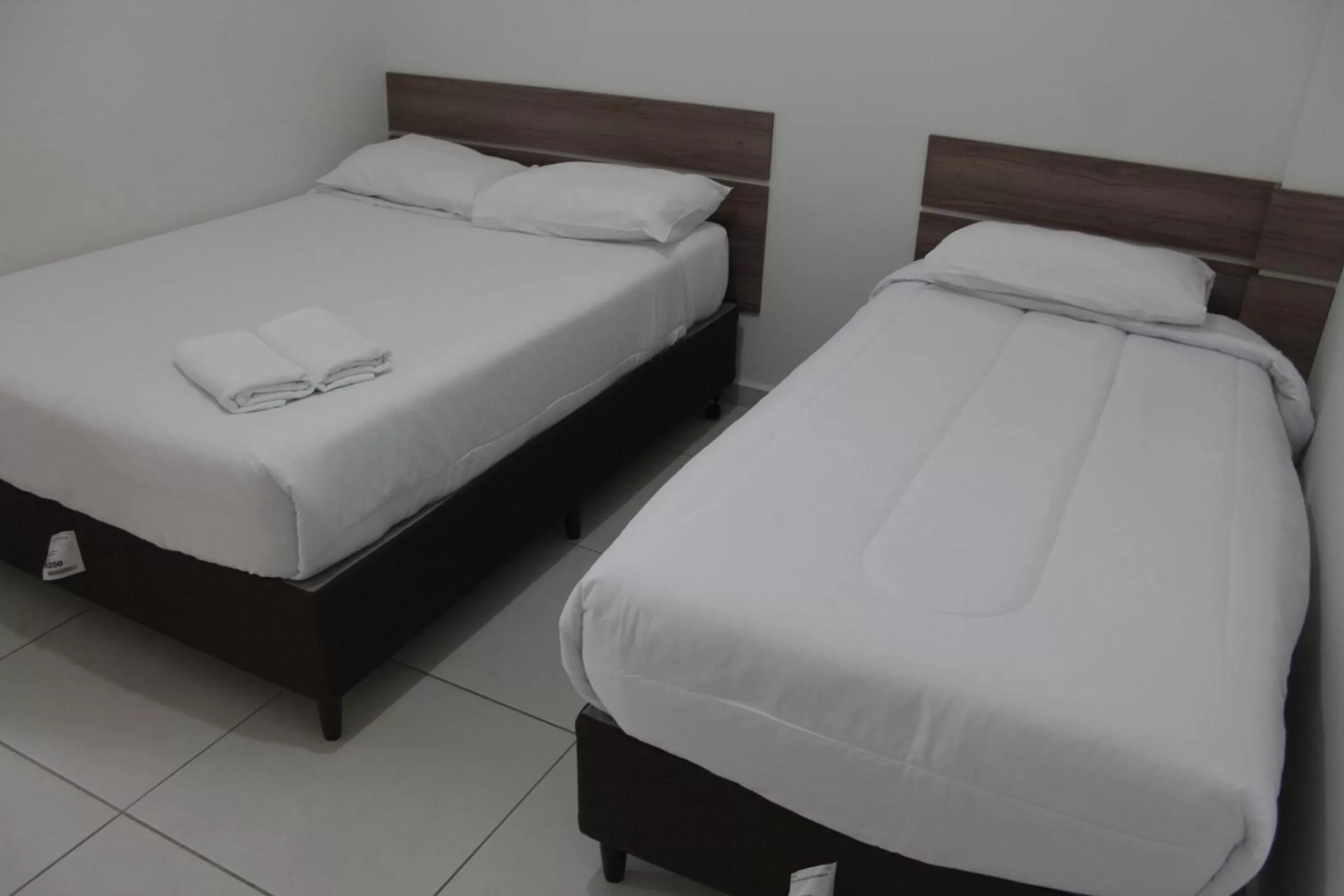 Bed in Leati's Hotel