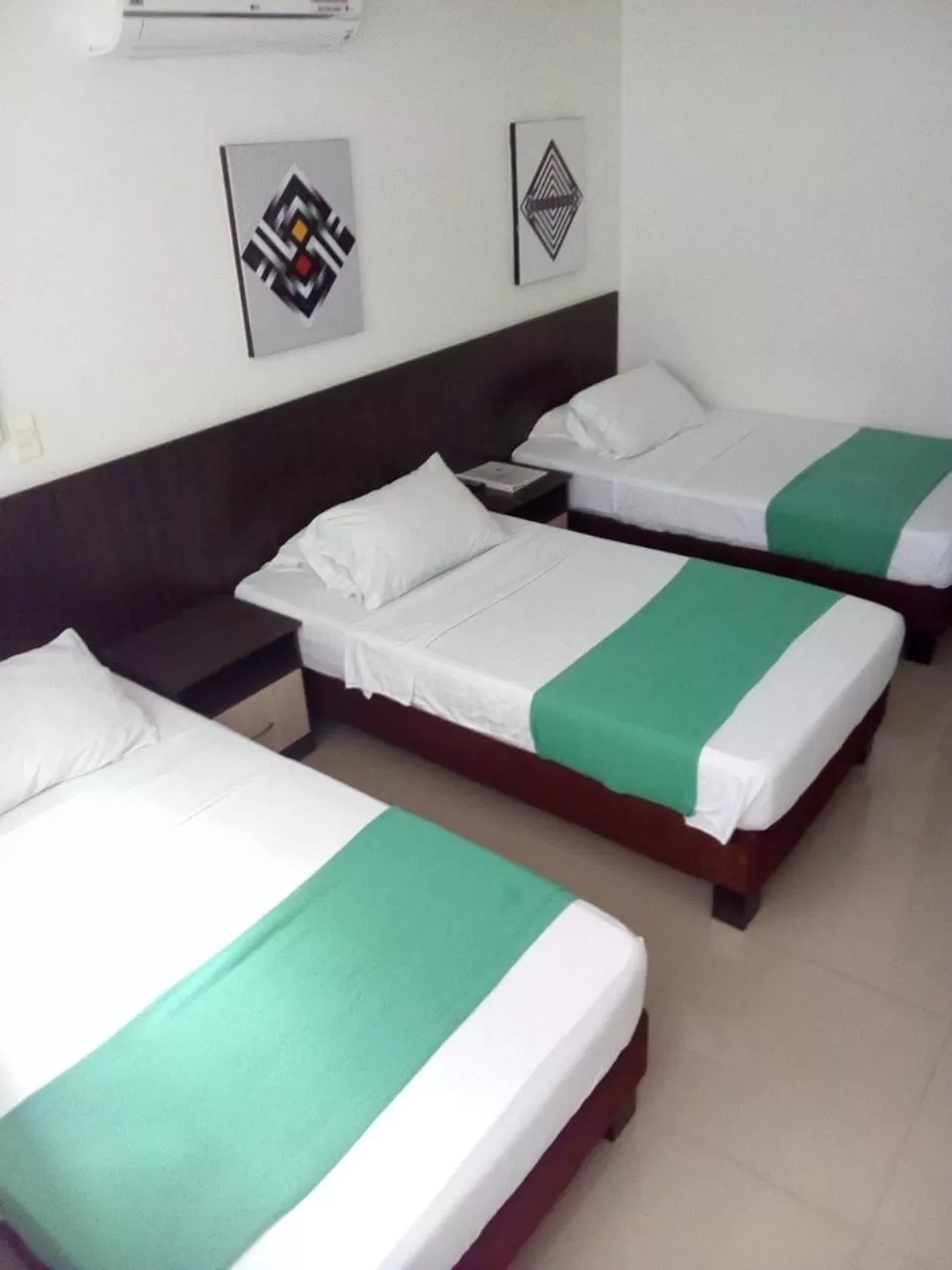 Photo of the whole room in Apartasuites San Marcos